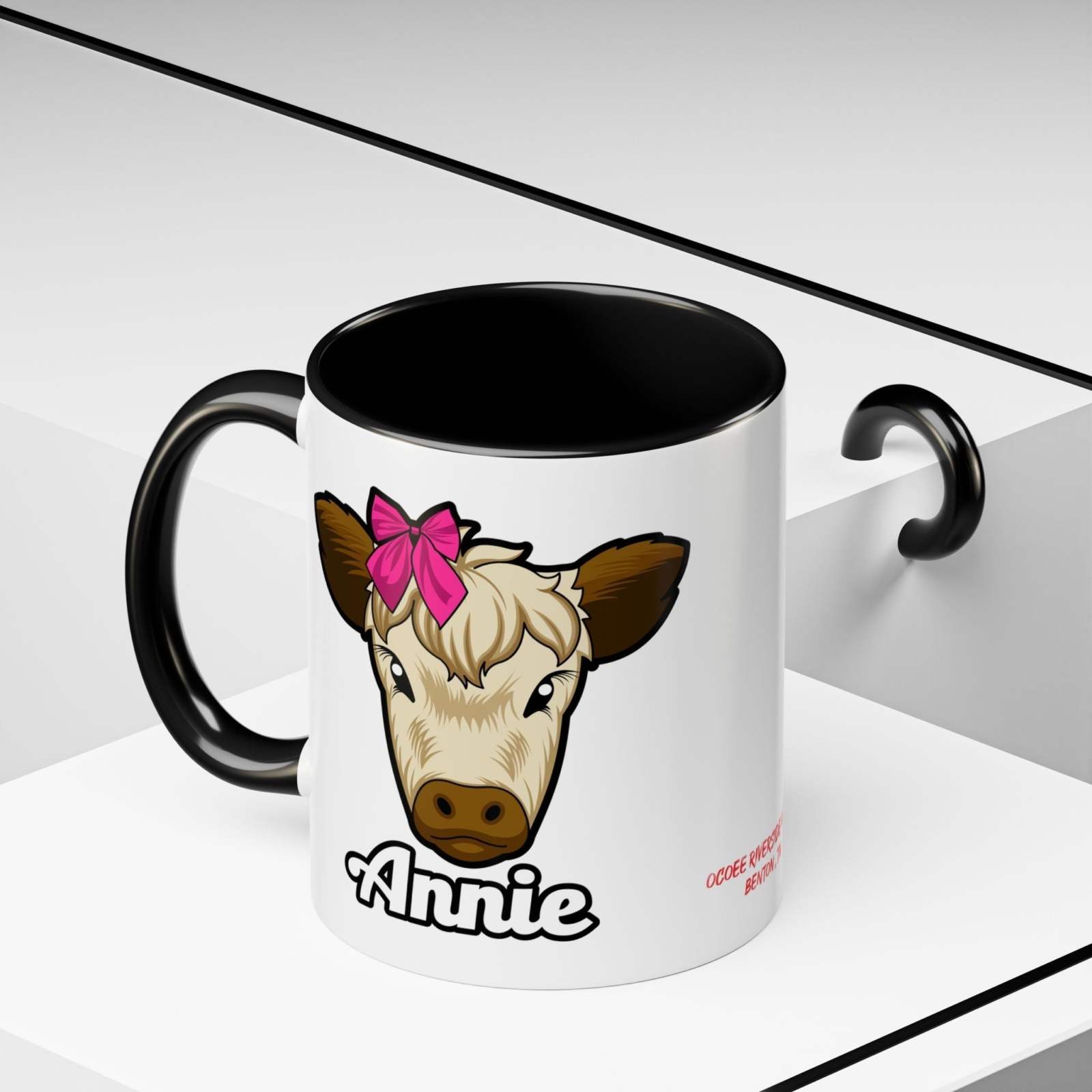 Farmhouse cow coffee mug with a red bow design, featuring "Annie" text, perfect for animal lovers and farmhouse décor enthusiasts.