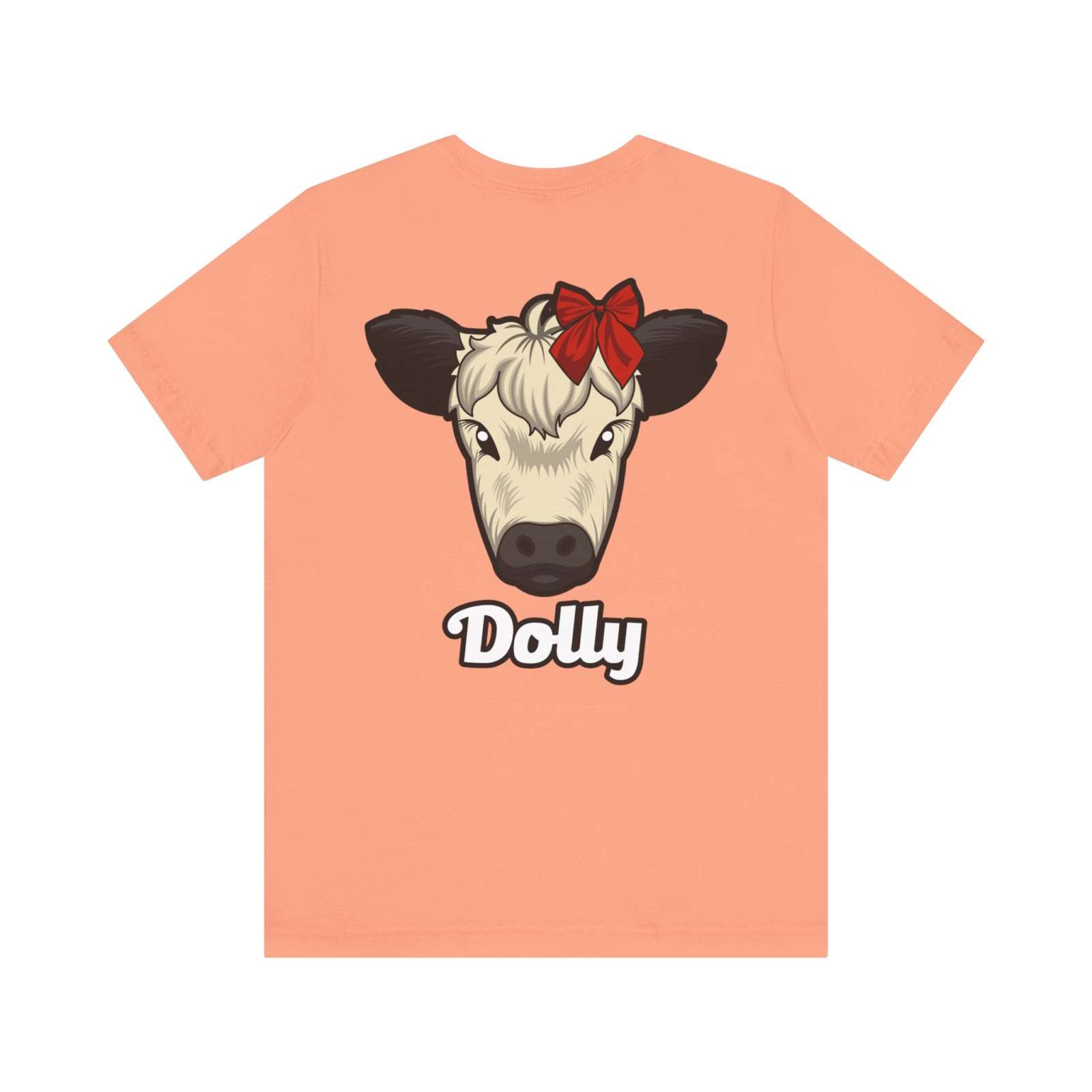 Peach Country Cow Graphic Tee featuring Dolly cow with red bow and text below.