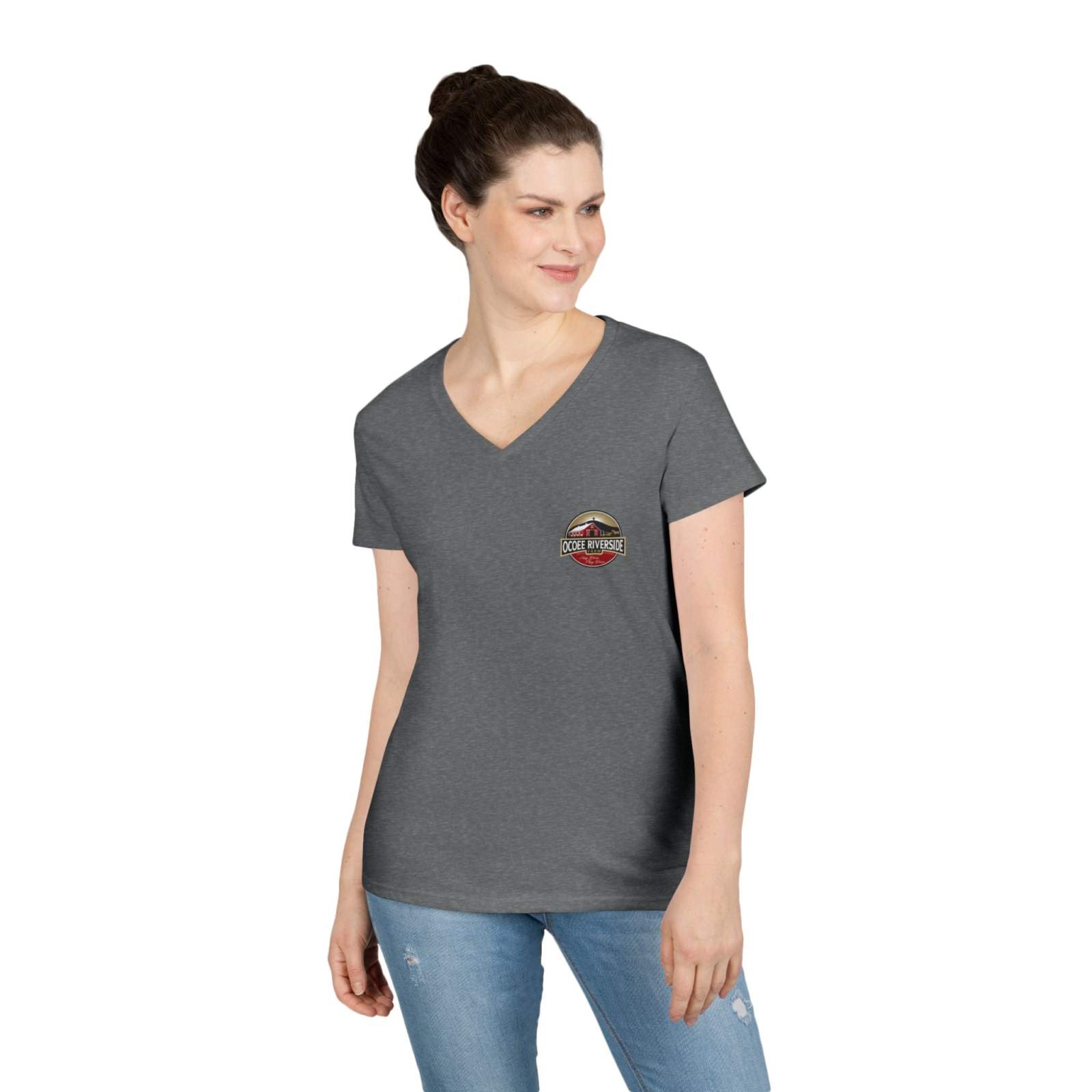 Woman wearing Rustic Farm Style V-Neck gray t-shirt with small farm-themed logo on chest and blue jeans