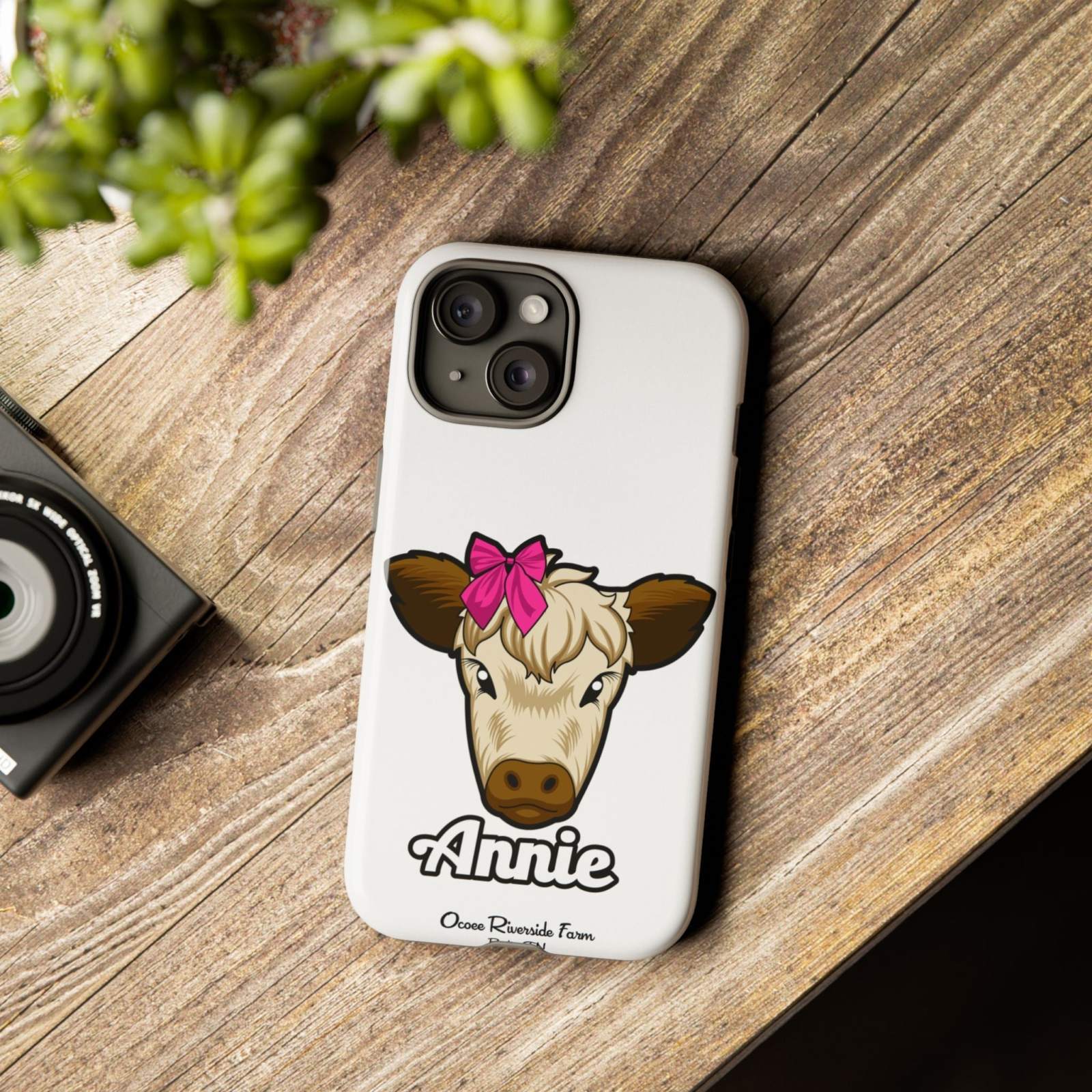 Cute cow phone case with red bow and farmhouse design, perfect farm animal lover gift, durable and stylish by Ocoee Riverside.