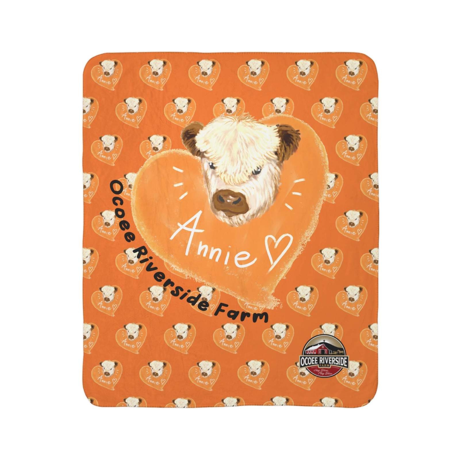 Orange cow-themed Sherpa blanket with heart pattern and cow illustration, featuring "Annie" and Ocoee Riverside Farm logo