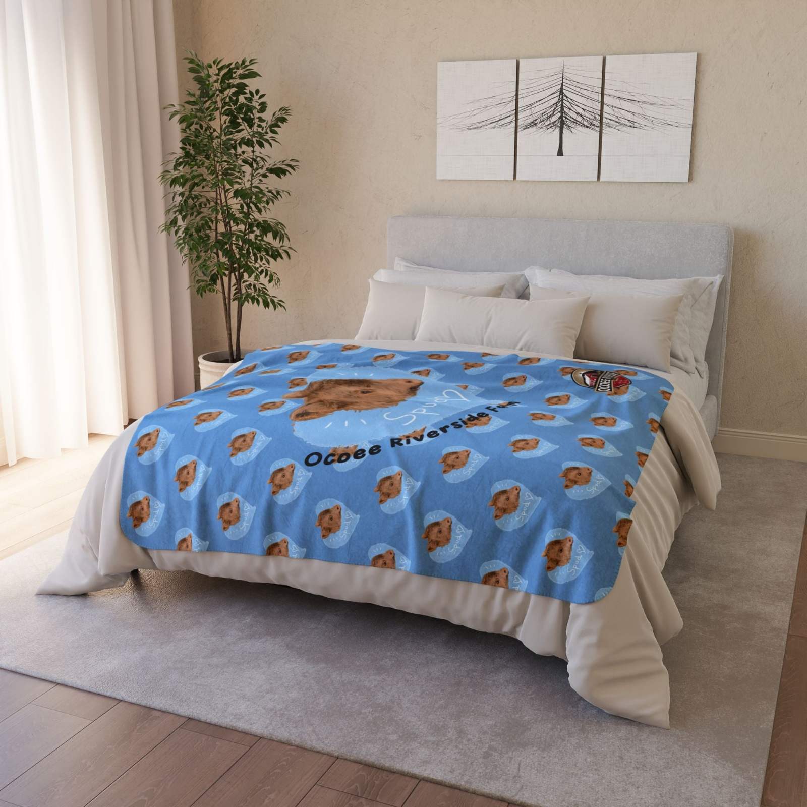 Blue Snuggly Farmhouse Blanket featuring Spud the Cow design on a bed in a cozy bedroom setting
