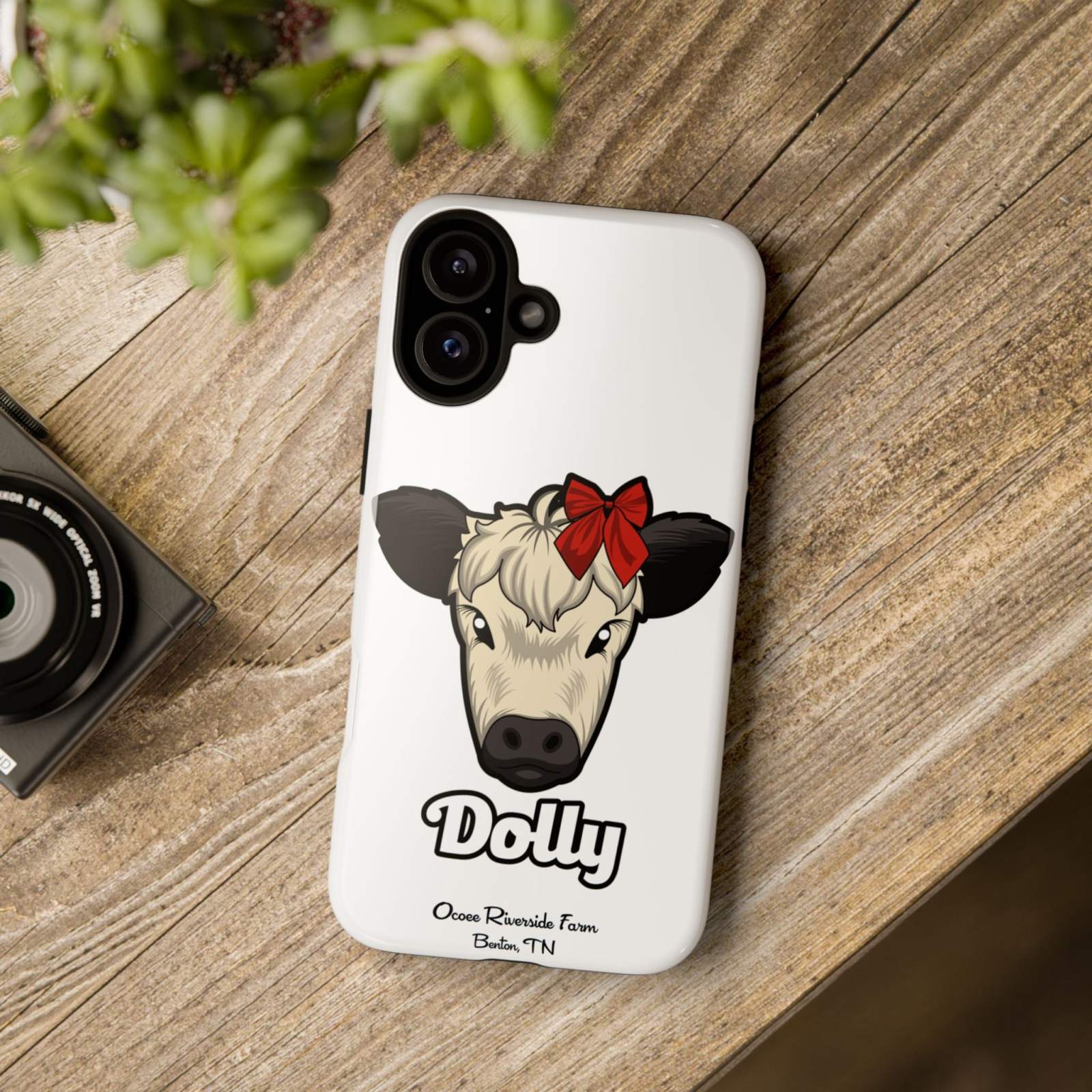 Farmhouse Chic Phone Case featuring Dolly the cow with a red bow on rustic wooden surface.