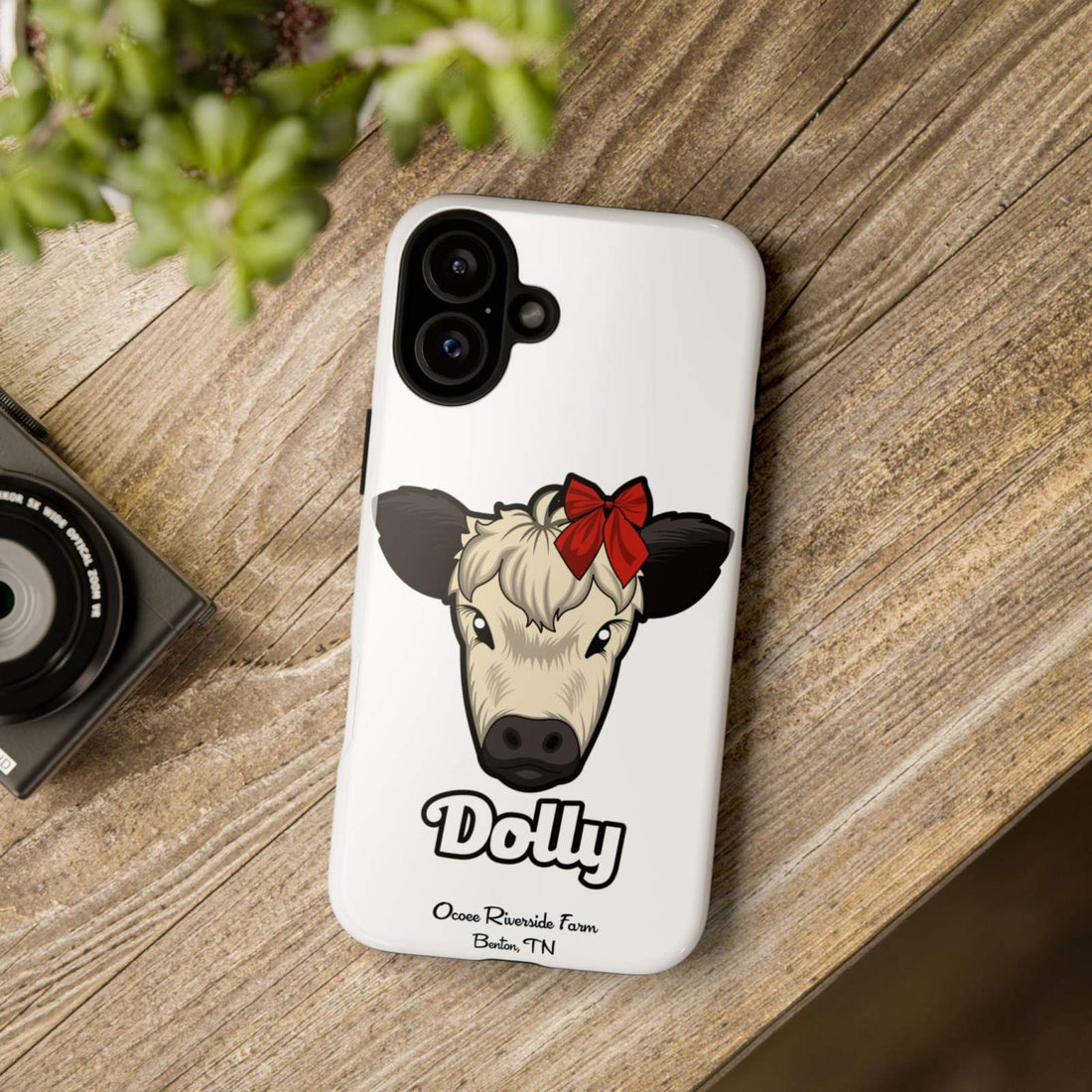 Farmhouse Chic Phone Case featuring Dolly the cow with a red bow on rustic wooden surface.