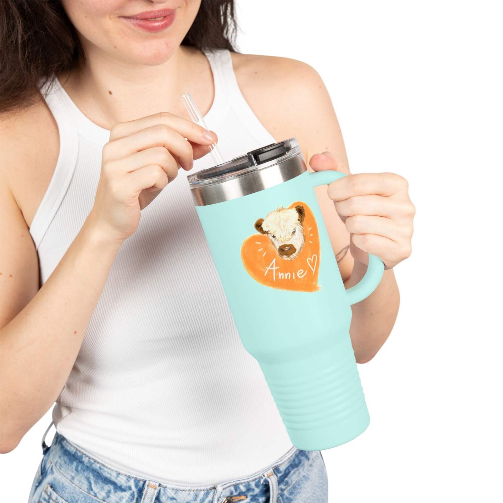 Personalized insulated travel mug 40oz in light blue with custom name and heart design shown being held by a woman