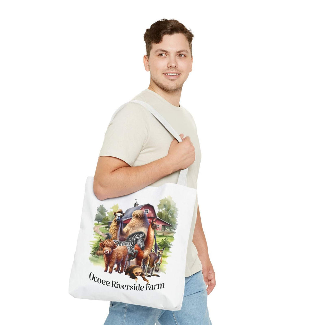 Man carrying Animals Tote Bag with farm animal designs and Ocoee Riverside Farm text
