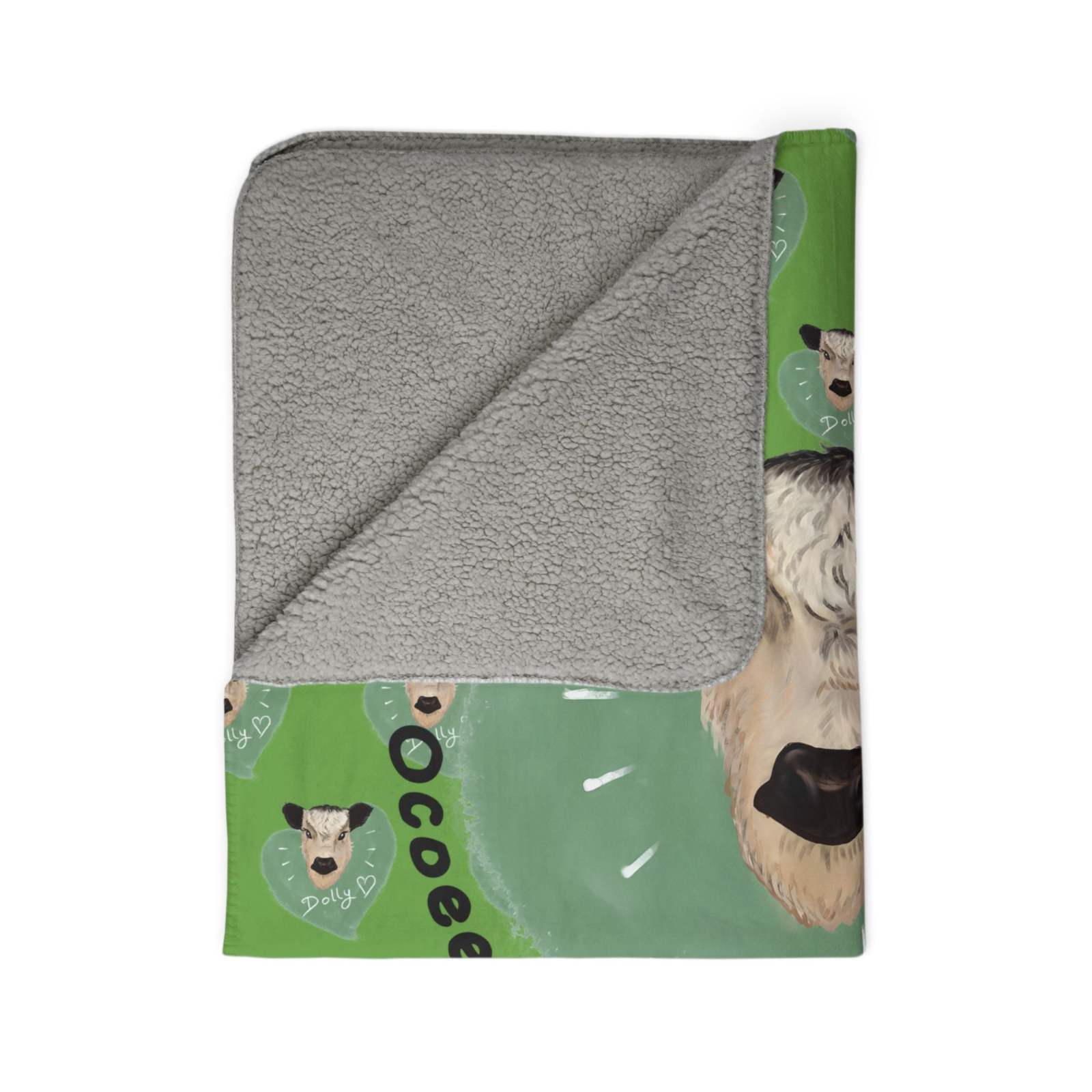Cozy Spud the Cow Blanket with soft sherpa lining and cute cow print on green farmhouse design