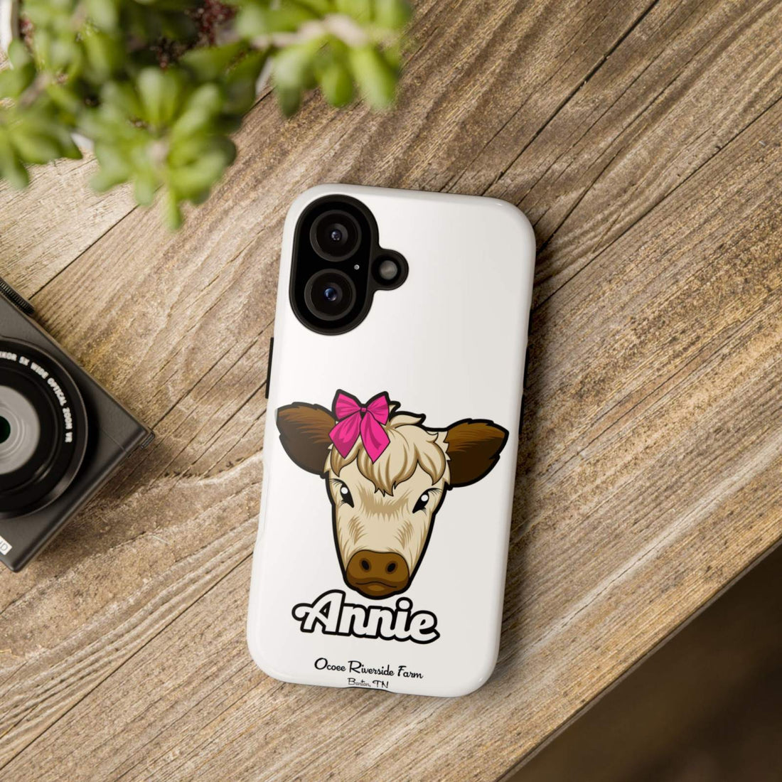 Cute cow phone case with red bow, durable farmhouse design for farm animal lover gift.