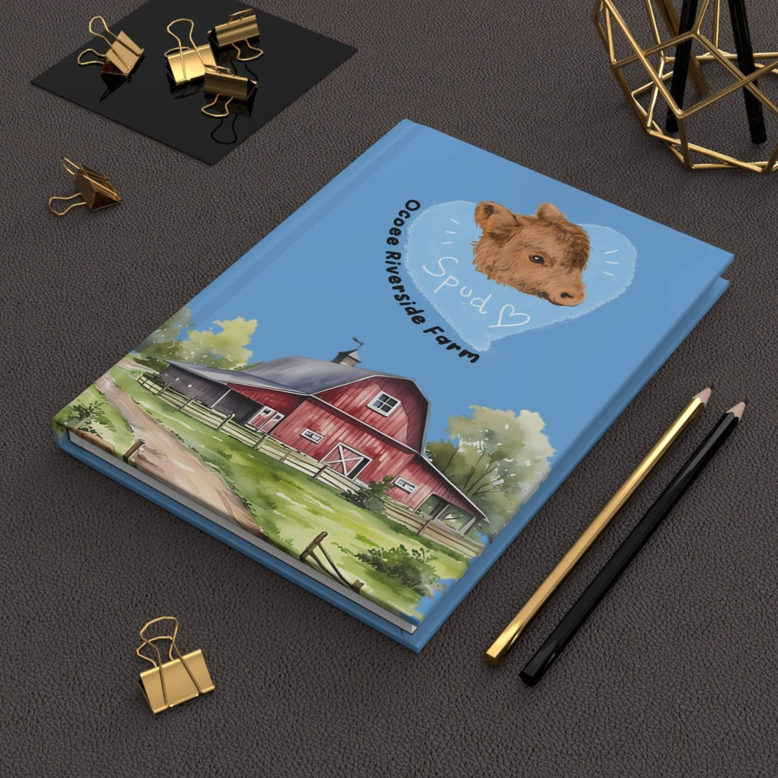 Rustic Cow Journal with farmhouse cover design featuring a cow illustration and red barn, hardcover notebook with 150 lined pages for writing and sketching