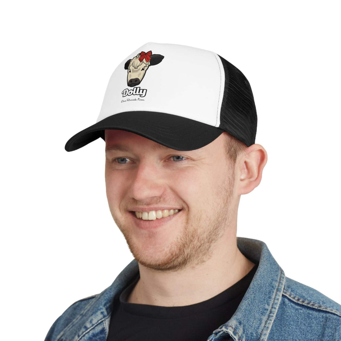 Man wearing Rustic Farm Trucker Hat with Dolly the red bow cow design, black and white color scheme