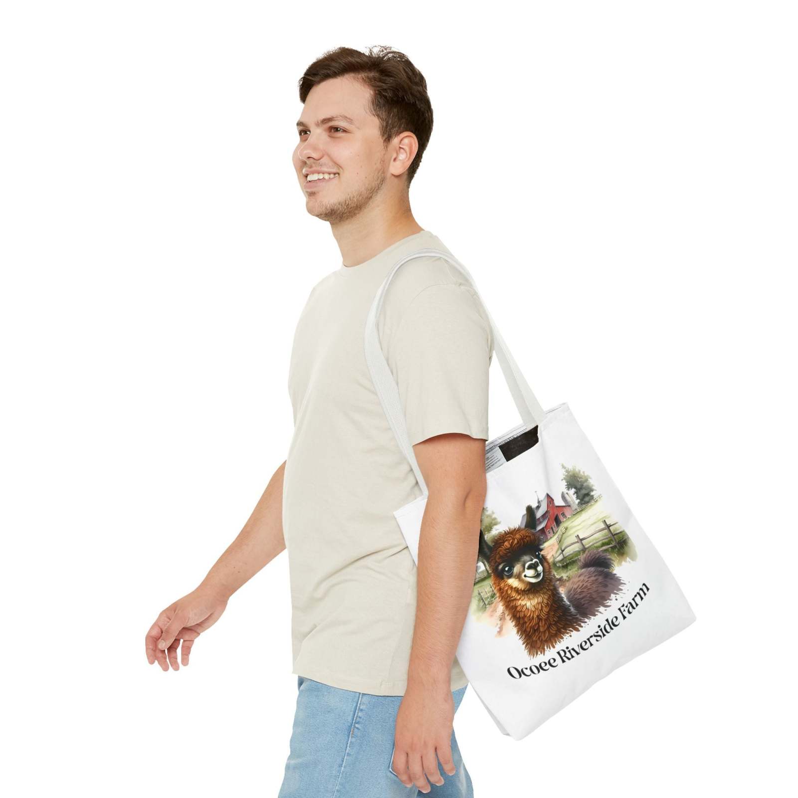 Man carrying Llama at Ocoee Riverside Farm Tote Bag with charming farm animal design and countryside scene.