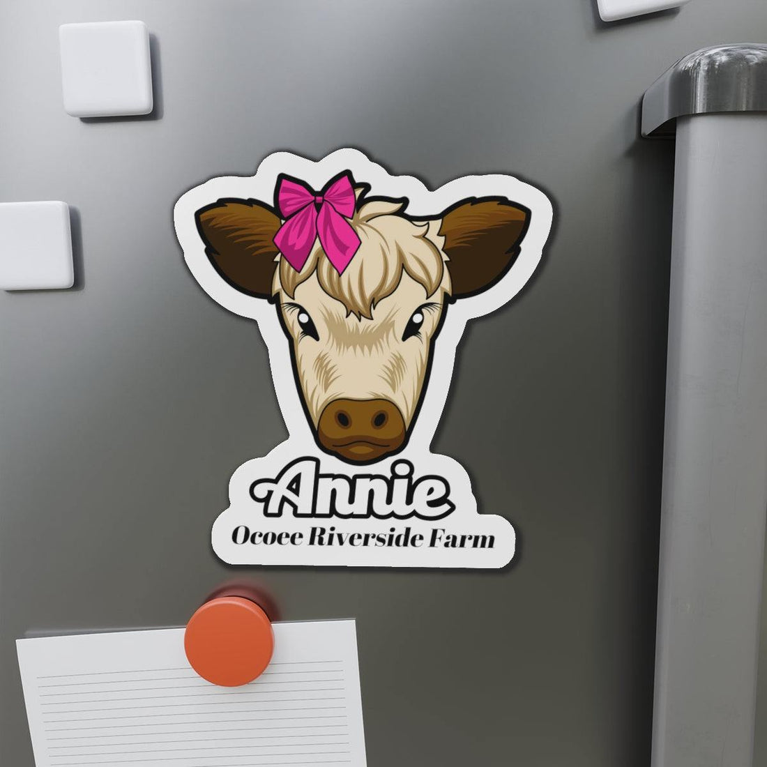 Cow die-cut magnet featuring a cute cow face with a pink bow and personalized text, ideal for fridge or office decor.