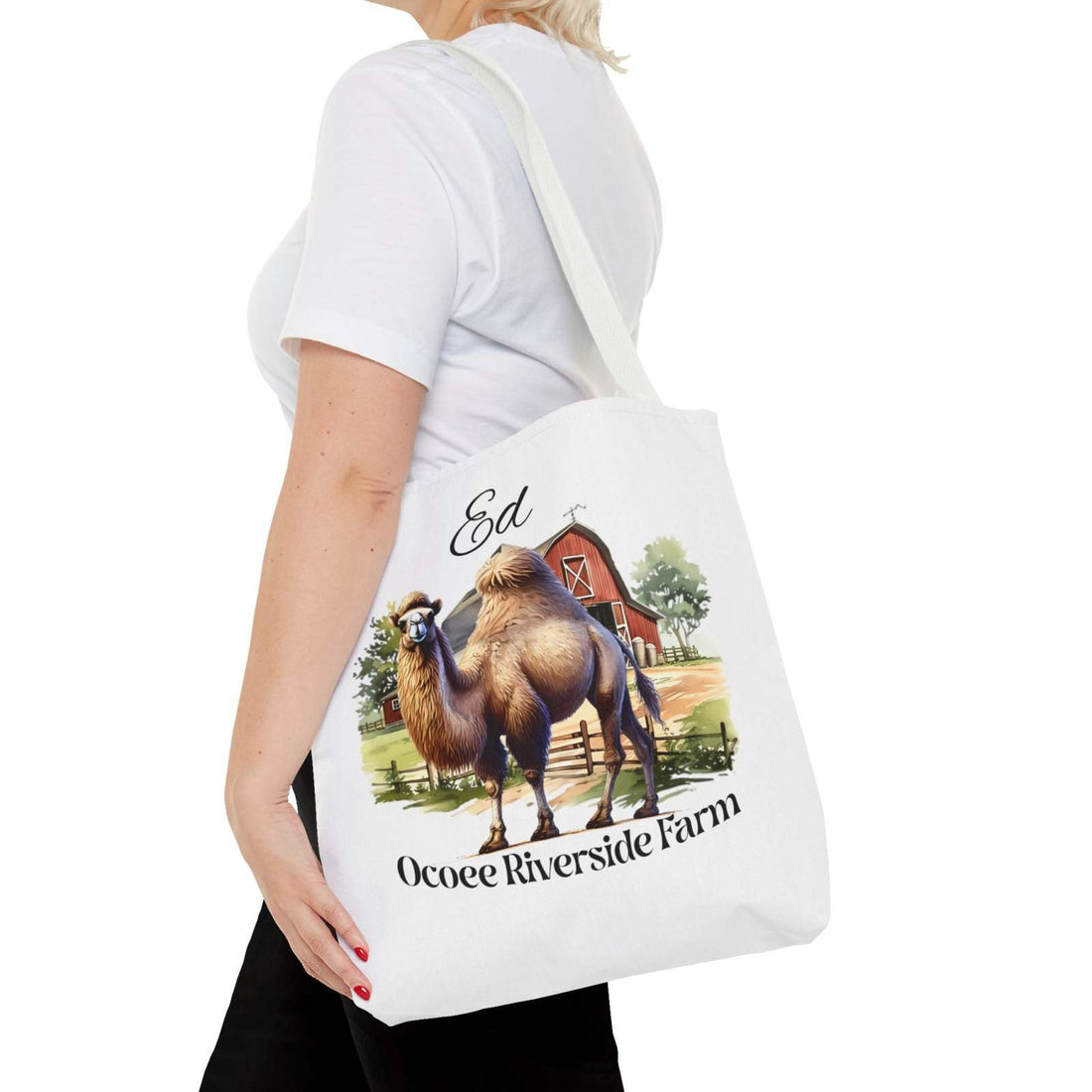 Woman carrying Ed Camel Tote Bag with Ocoee Riverside Farm camel and barn design, eco-friendly reusable shopping bag