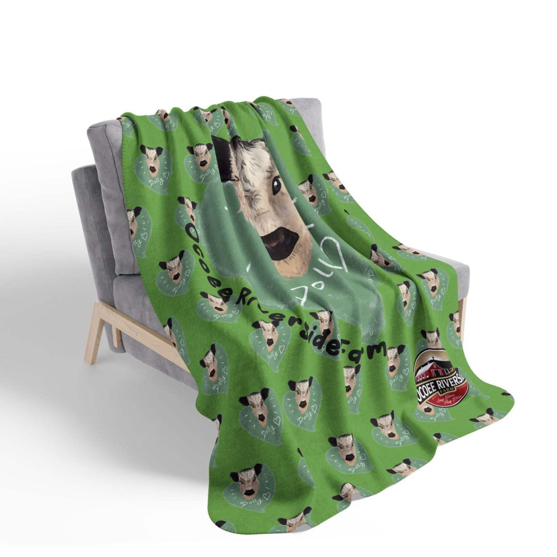 Cozy Spud the Cow Blanket soft green sherpa throw with cow faces draped on gray chair