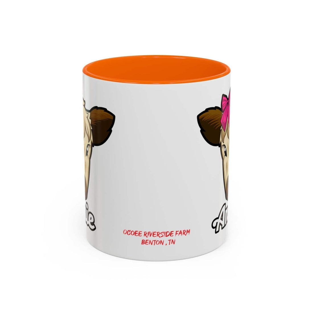 Farmhouse cow coffee mug with red bow design, ceramic, and orange interior.