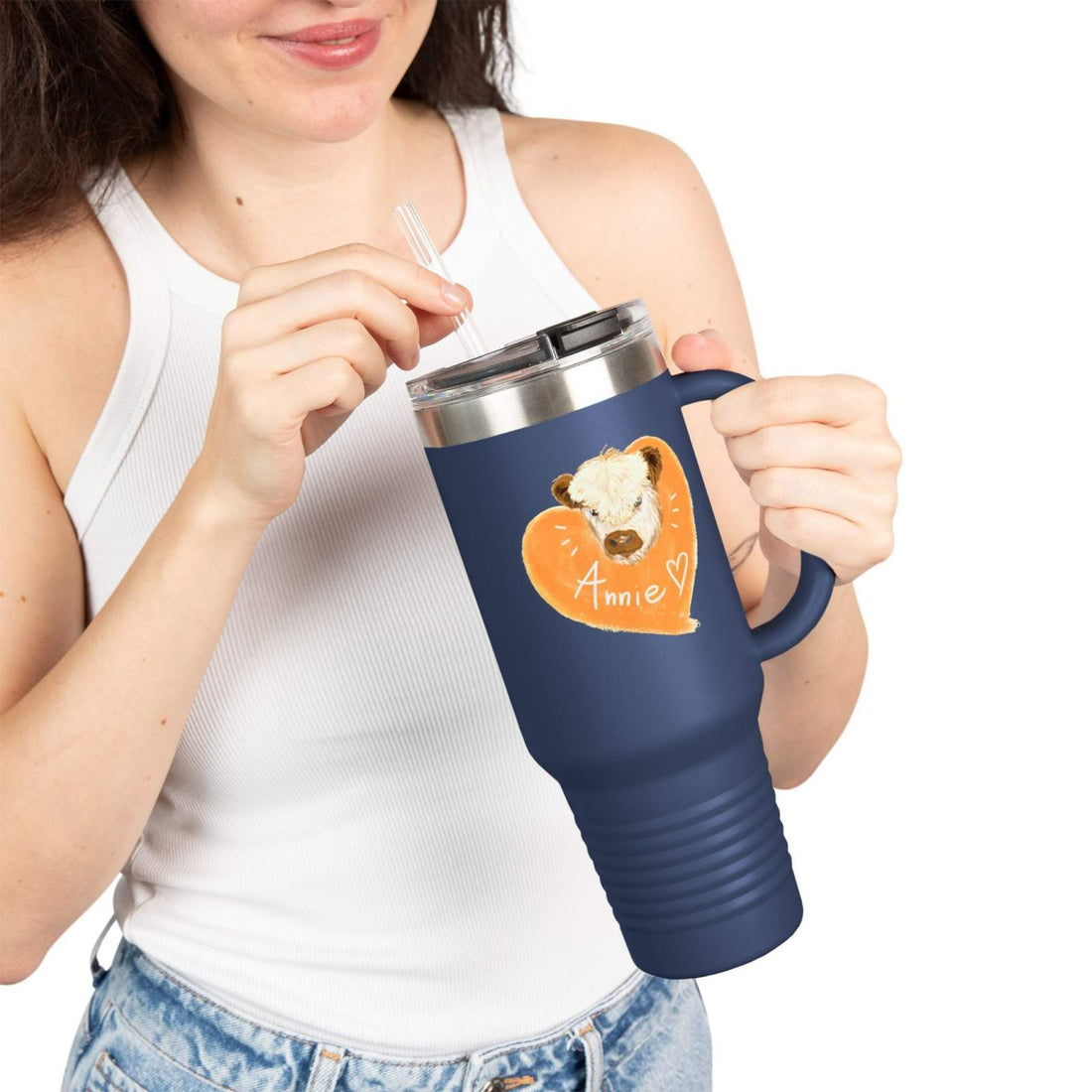 Personalized insulated travel mug 40oz navy blue with custom bear and heart design held by woman in white tank top