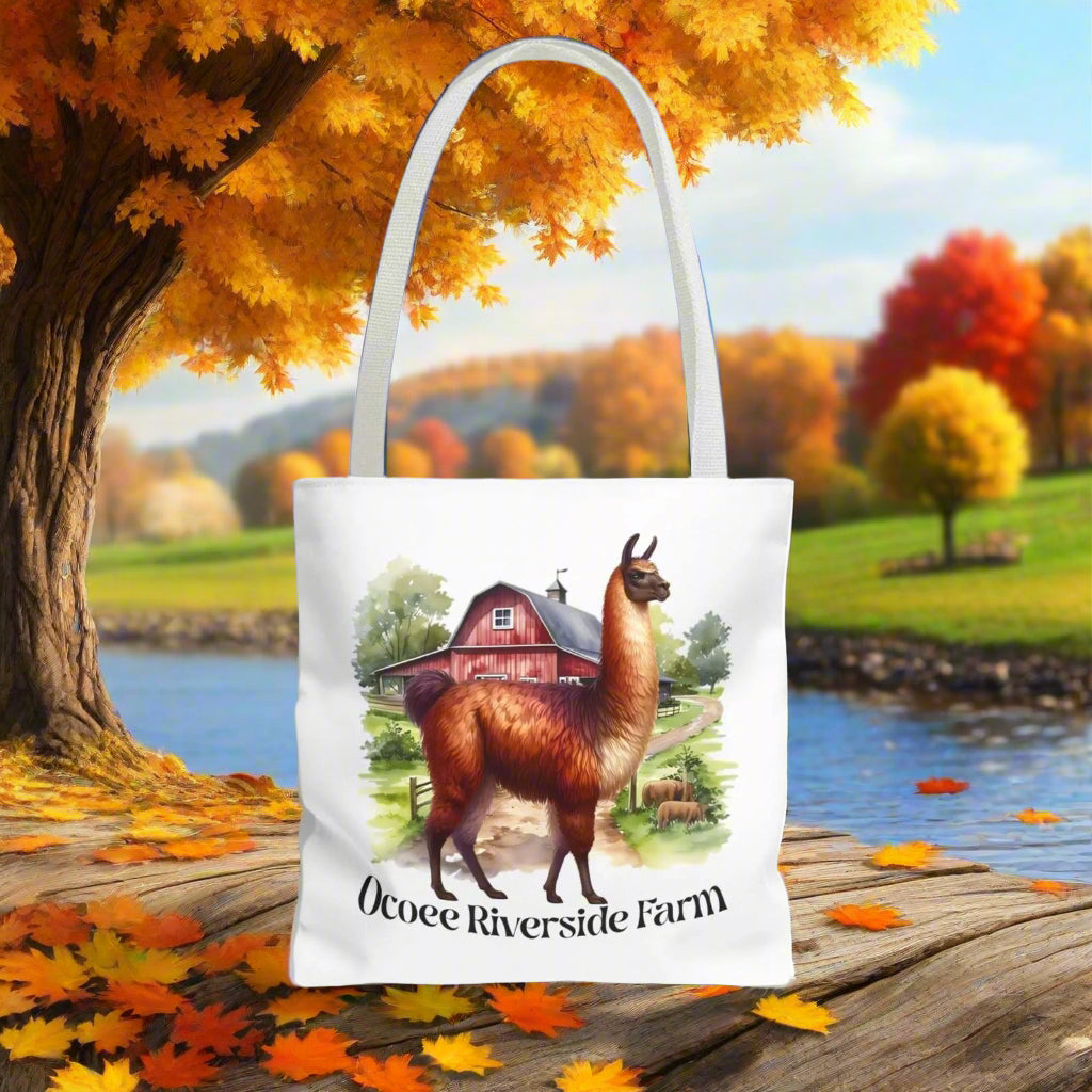 Eco-friendly Alpaca Tote Bag featuring Ocoee Riverside Farm design with farm and alpaca illustration, durable polyester with reinforced handles.