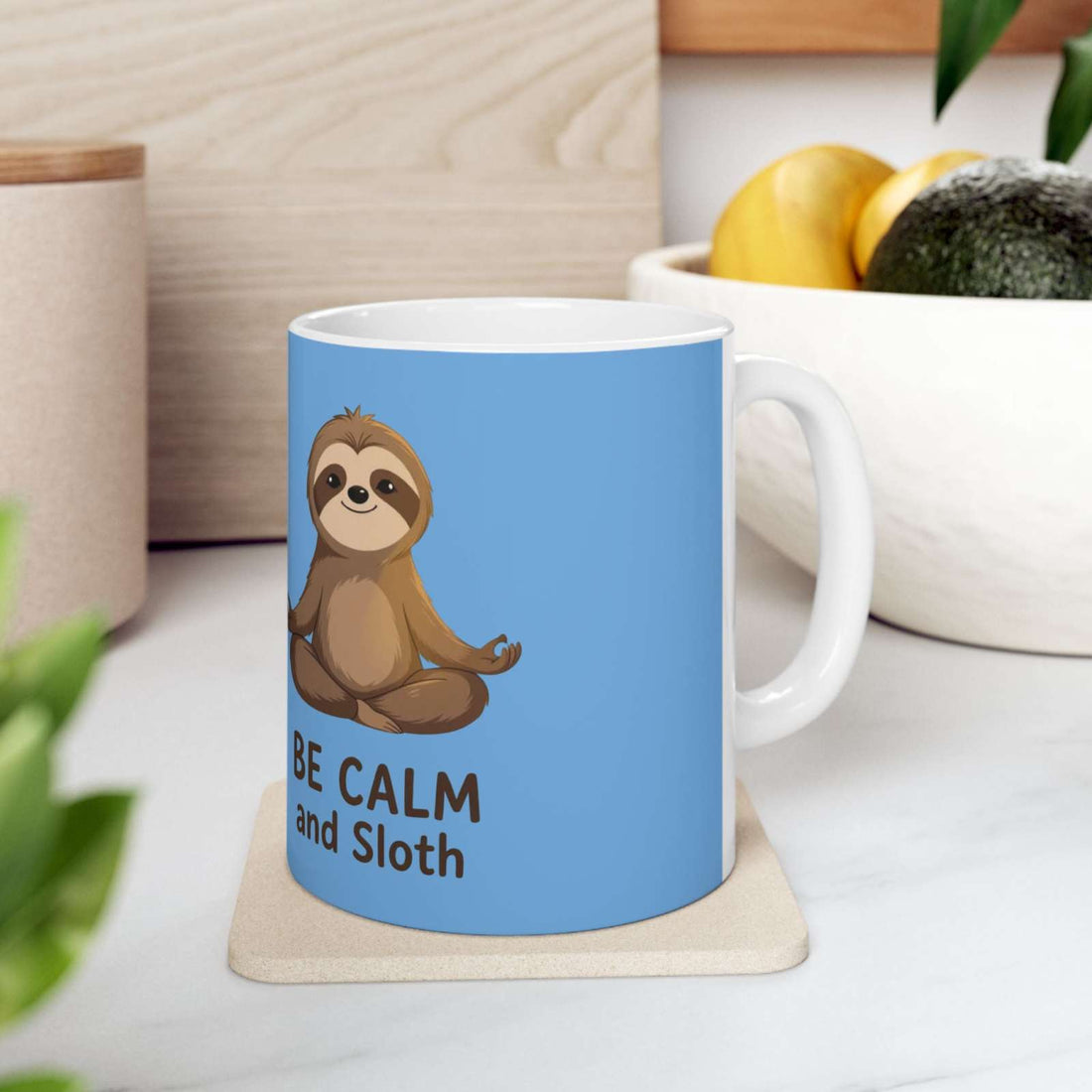 Be Calm and Sloth Mug ceramic coffee cup with cute meditating sloth design on blue background