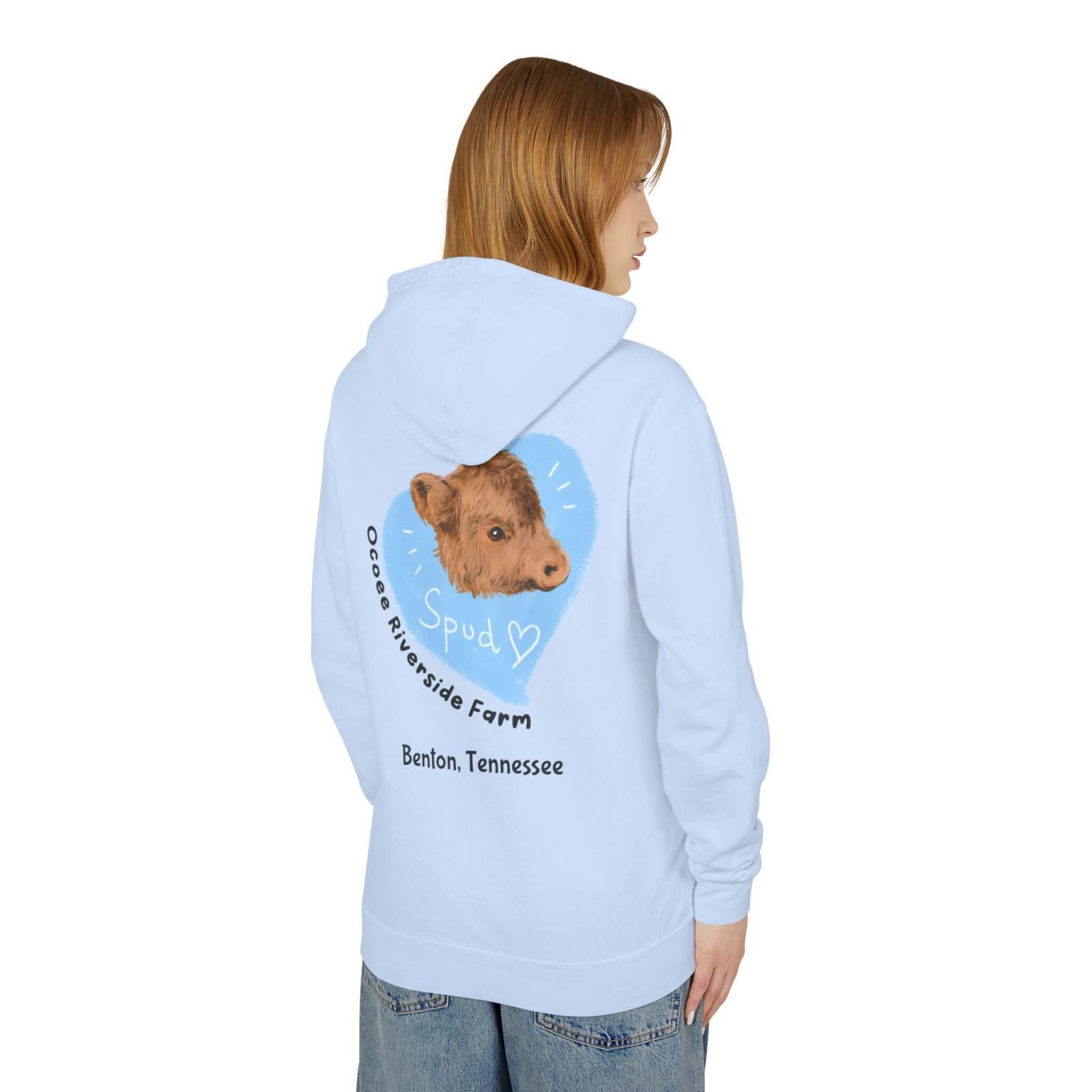 Woman wearing light blue Cute Cow Lightweight Hoodie with cow graphic and Ocoee Riverside Farm text on back
