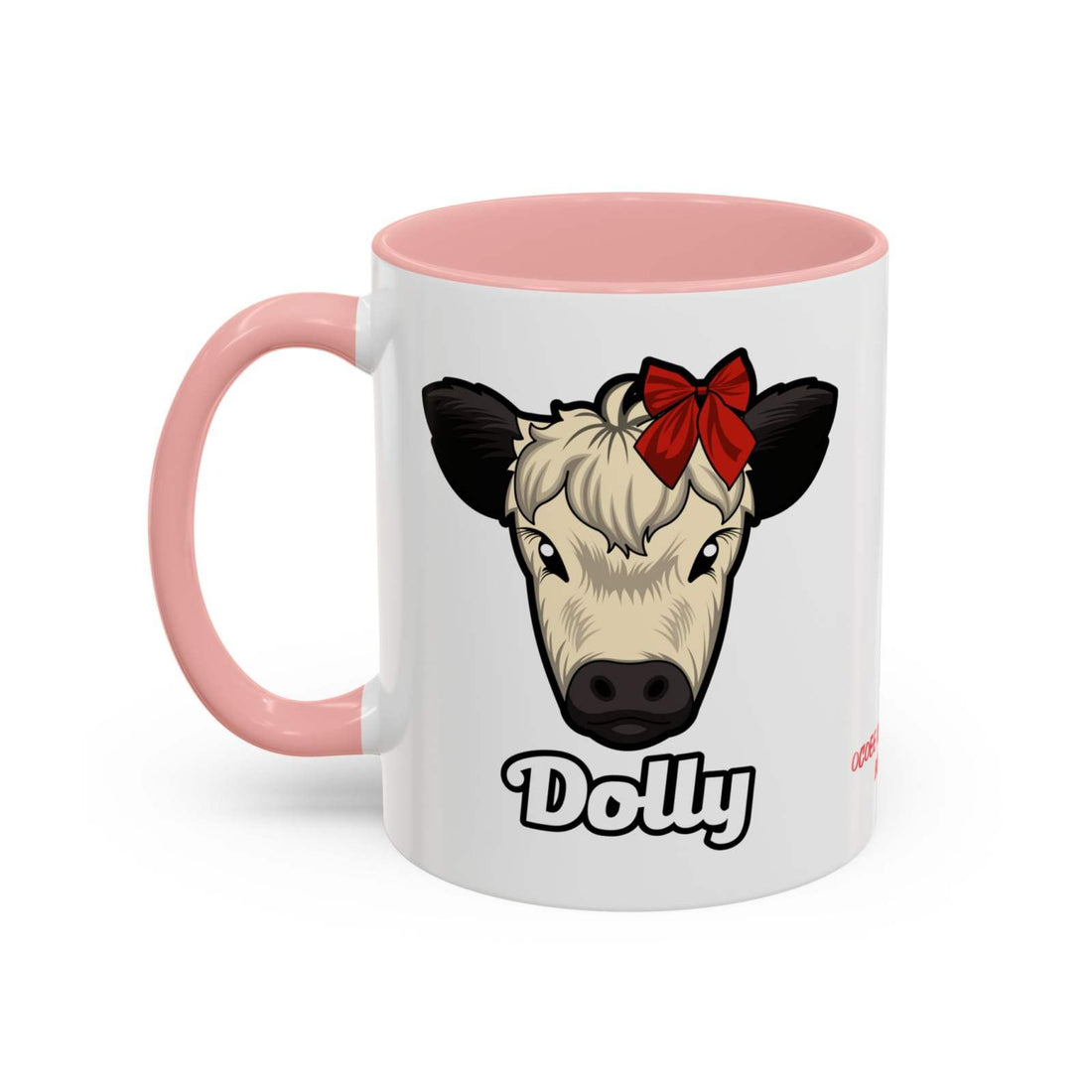 White ceramic farm animal coffee mug with pink handle and interior, featuring a cute cow face named Dolly wearing a red bow.