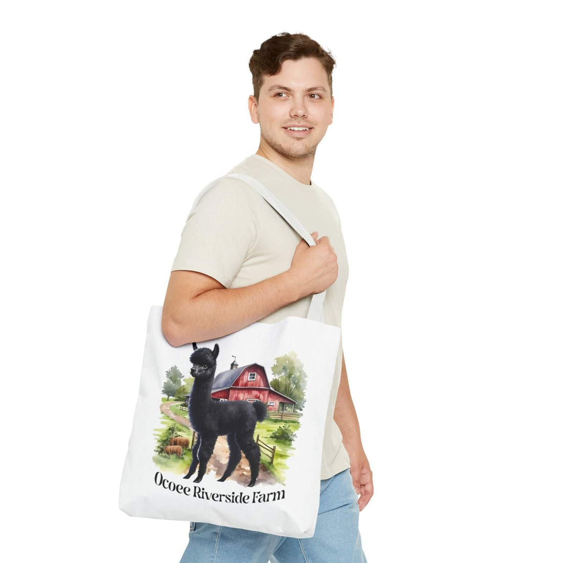 Man carrying eco-friendly Llama Tote Bag with black llama and Ocoee Riverside Farm design