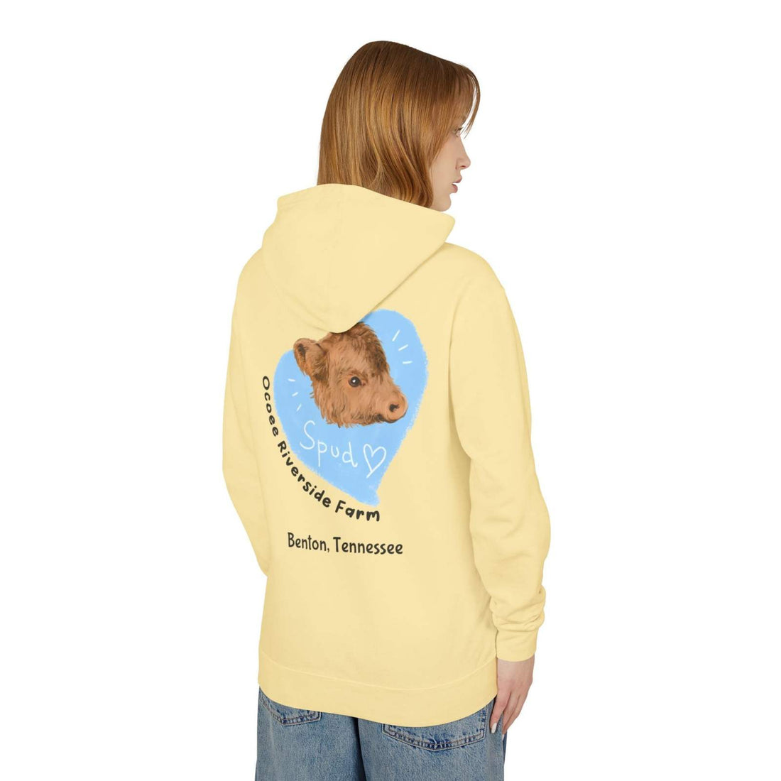Person wearing a pale yellow Cute Cow Lightweight Hoodie with a cow graphic and "Ocoee Riverside Farm, Benton, Tennessee" text on the back.