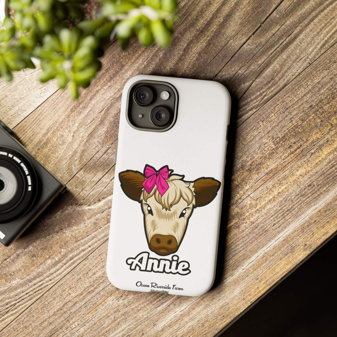 Cute cow phone case with red bow, stylish and durable gift for farm animal lovers.