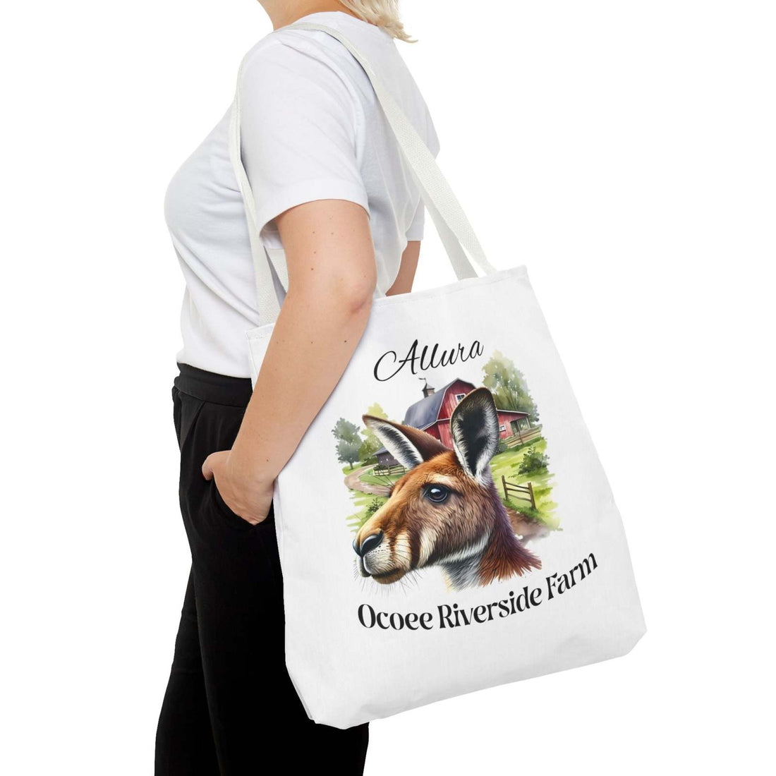 Woman carrying Allura Kangaroo Tote Bag with Ocoee Riverside Farm design featuring kangaroo and farmhouse illustration