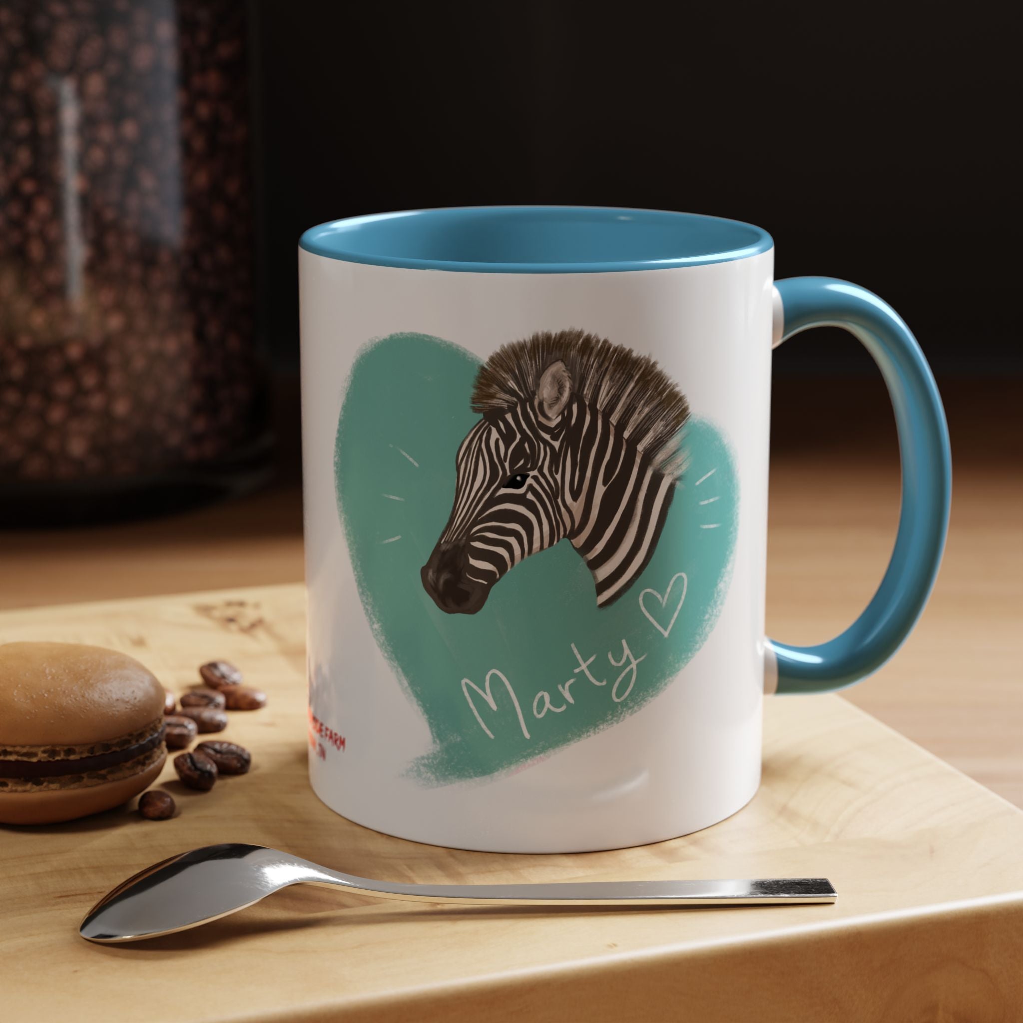 A zebra adorned with the word "Marty" creatively integrated into its stripes at Ocoee Riverside Farm Coffee Mug
