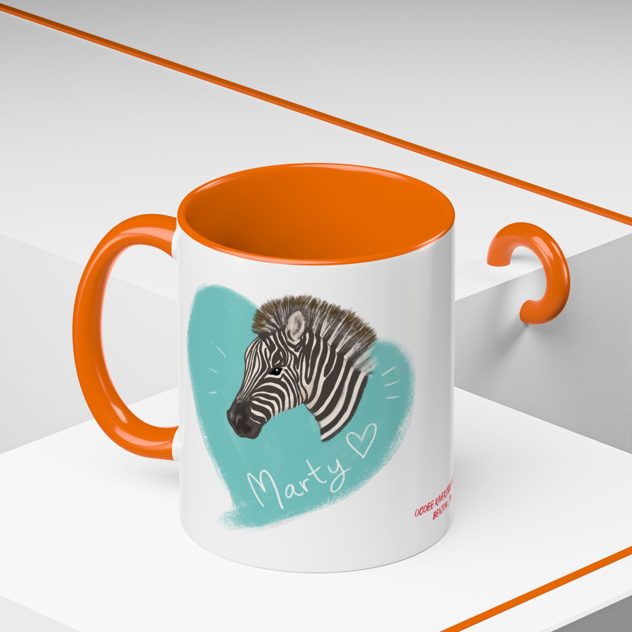 A zebra adorned with the word "Marty" creatively integrated into its stripes at Ocoee Riverside Farm Coffee Mug