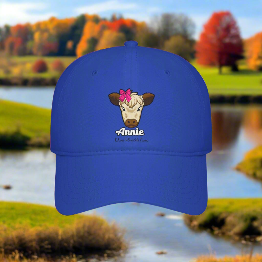 A cow adorned with a red bow on its head Named Annie - Ocoee Riverside Baseball Cap
