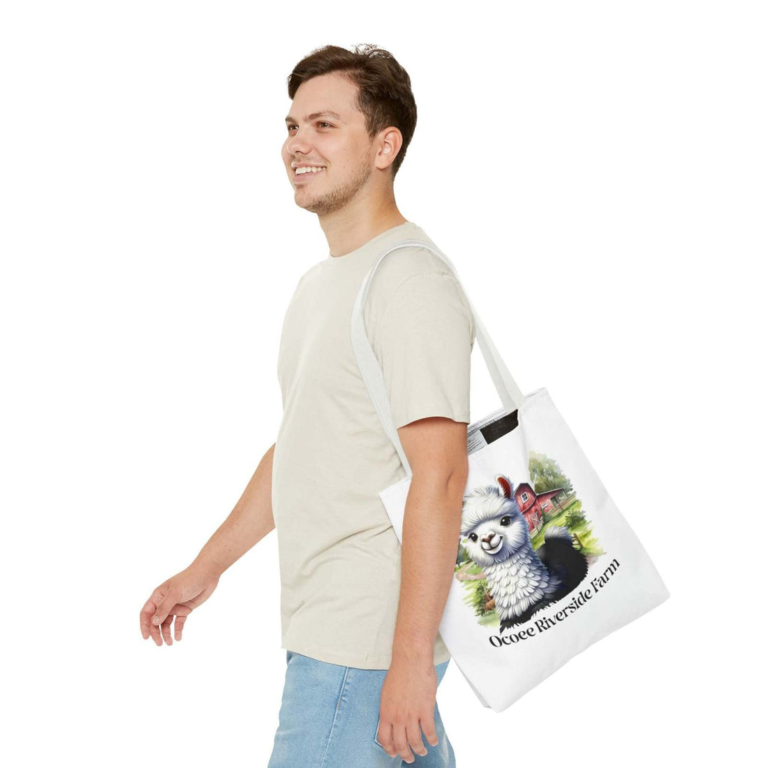 Man carrying white Alpaca Tote Bag with colorful alpaca and farm design from Ocoee Riverside Farm, eco-friendly shopping bag
