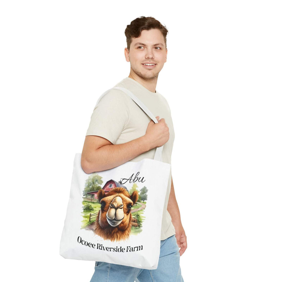 Man carrying Abu Camel Tote Bag with camel design and Ocoee Riverside Farm text, eco-friendly shopping bag