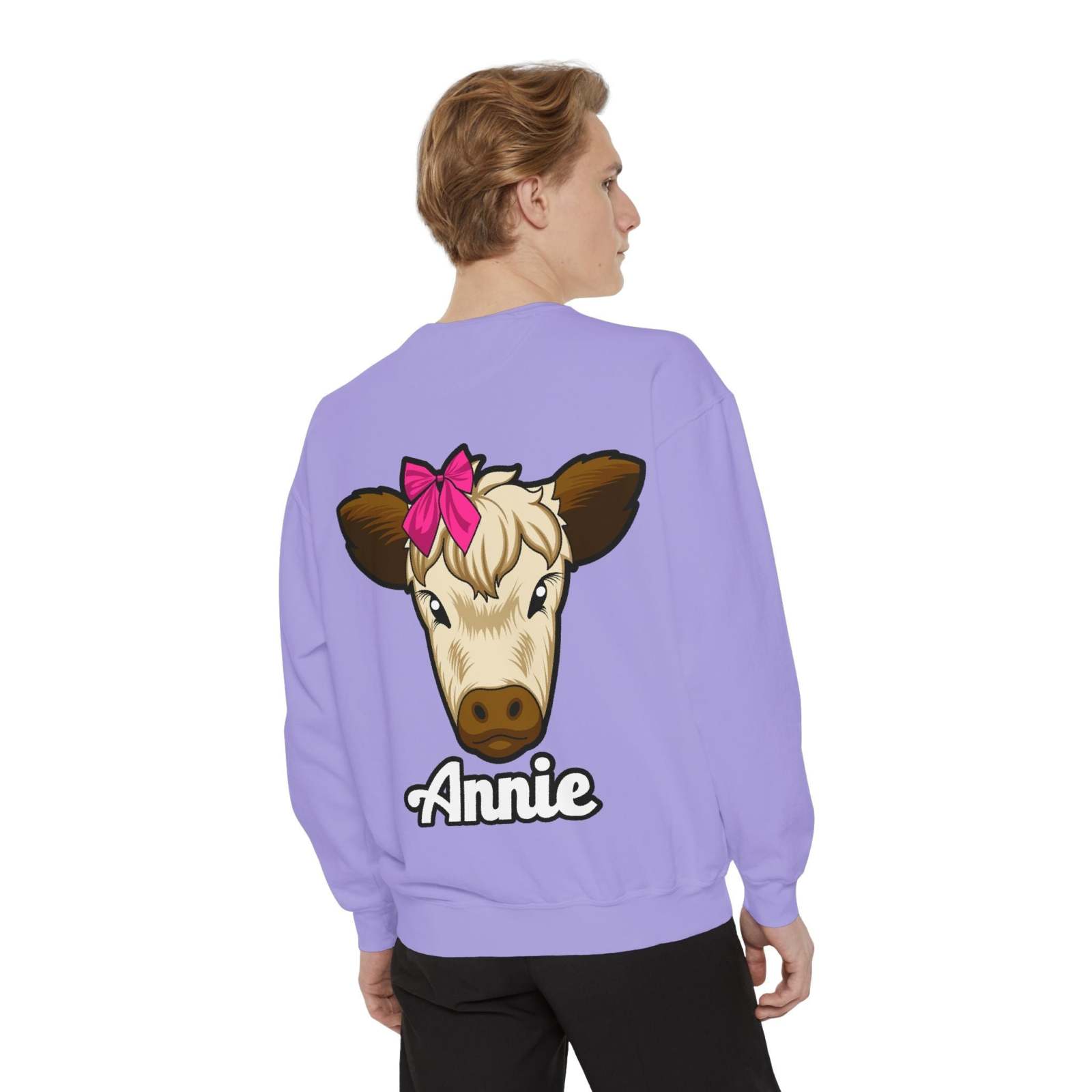 Cute farm animal sweatshirt with embroidered cow graphic and red bow, featuring "Annie" text on a purple background.