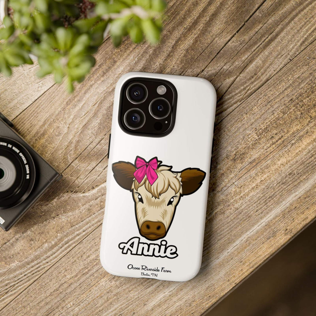 Cute cow phone case with red bow for farm animal lovers.
