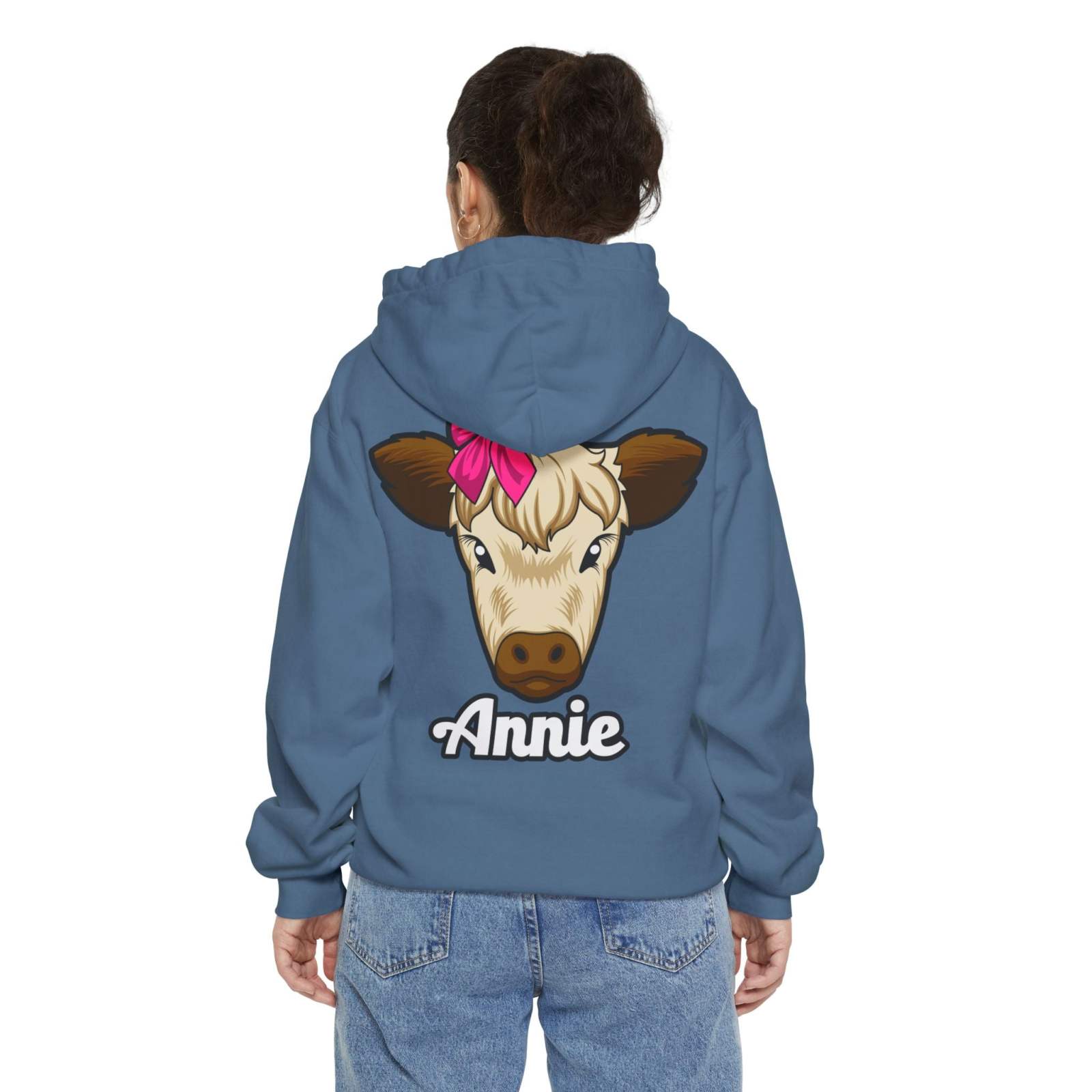 Blue unisex hoodie with a cute cow illustration and the name "Annie" on the back, ideal for farm animal lovers.