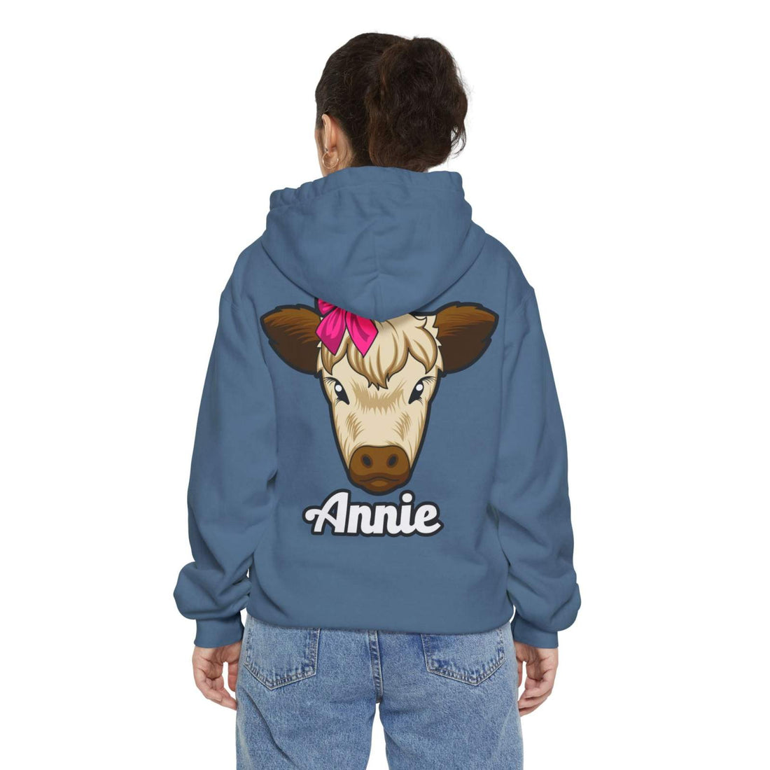 Blue unisex hoodie with a cute cow illustration and the name "Annie" on the back, ideal for farm animal lovers.