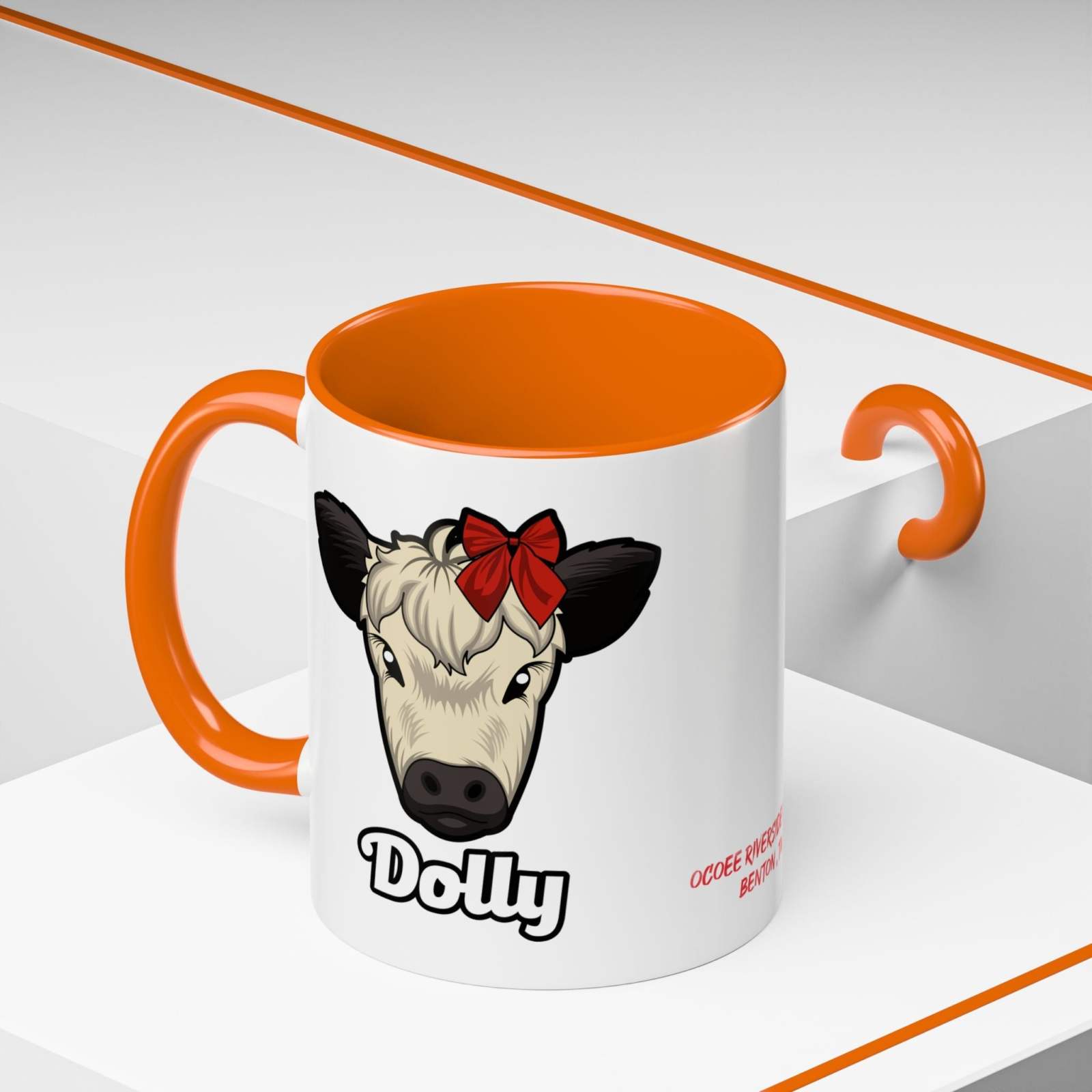 Farm Animal Coffee Mug featuring Dolly the cow with a red bow, orange handle and interior, ceramic farmhouse-style mug