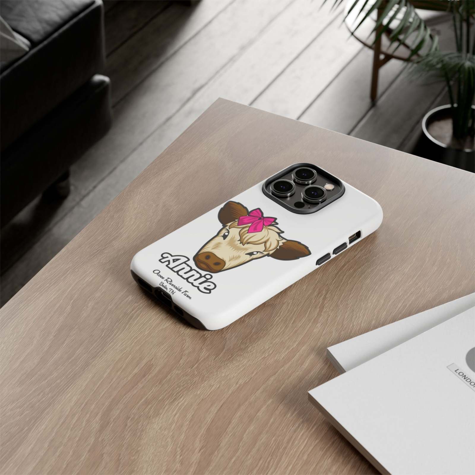 Cute farmhouse cow phone case with red bow, perfect farm animal lover gift.