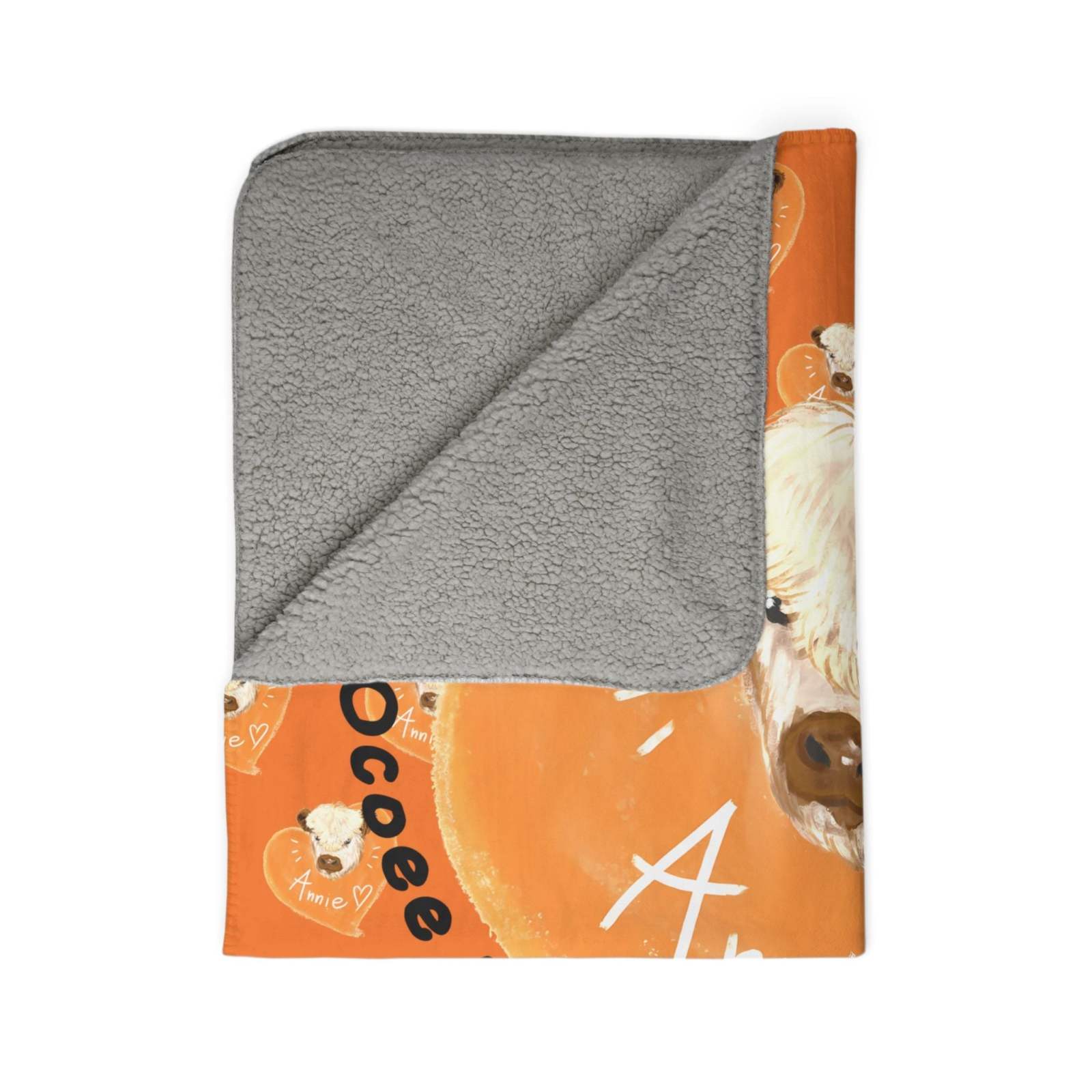 Cozy cow-themed Sherpa blanket with soft gray fleece backing and rustic orange cow design