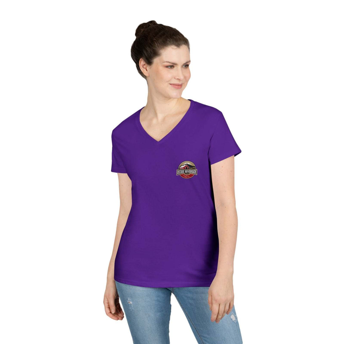 Woman wearing purple Tennessee Farm Life V-Neck t-shirt with spud heart design, paired with blue jeans