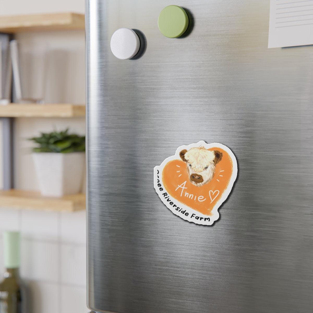 Cute Cow Design Die-Cut Magnet in orange heart shape with cow illustration on a stainless steel fridge for farm animal decor