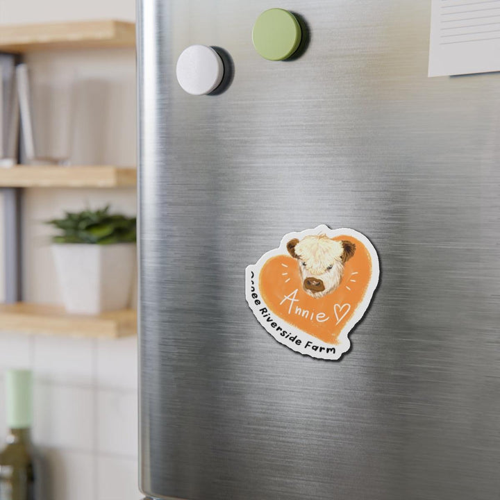 Cute Cow Design Die-Cut Magnet in orange heart shape with cow illustration on a stainless steel fridge for farm animal decor