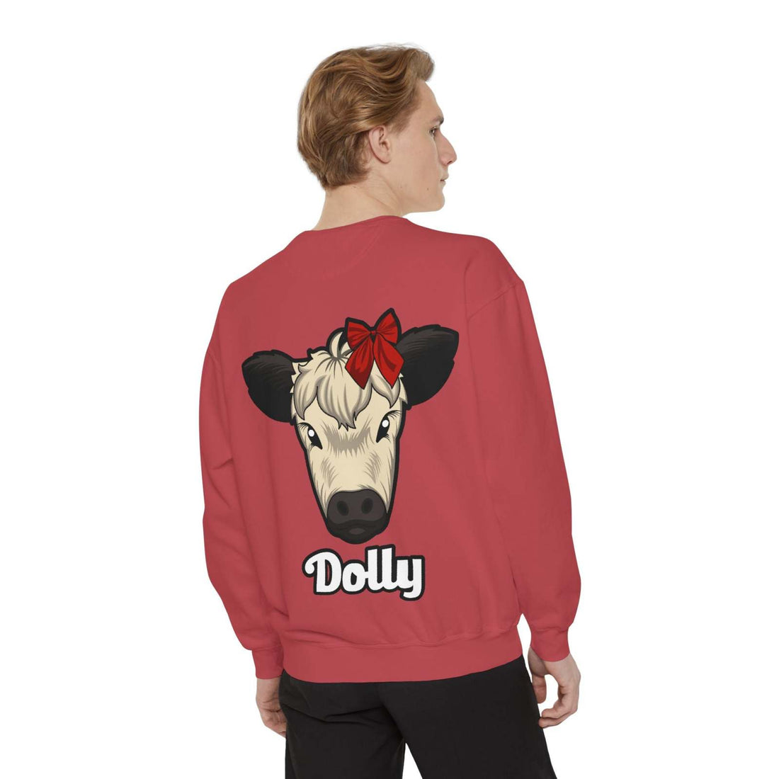 Person wearing red Farmhouse Cow Sweatshirt with Dolly the Red Bow Cow graphic on back and black pants