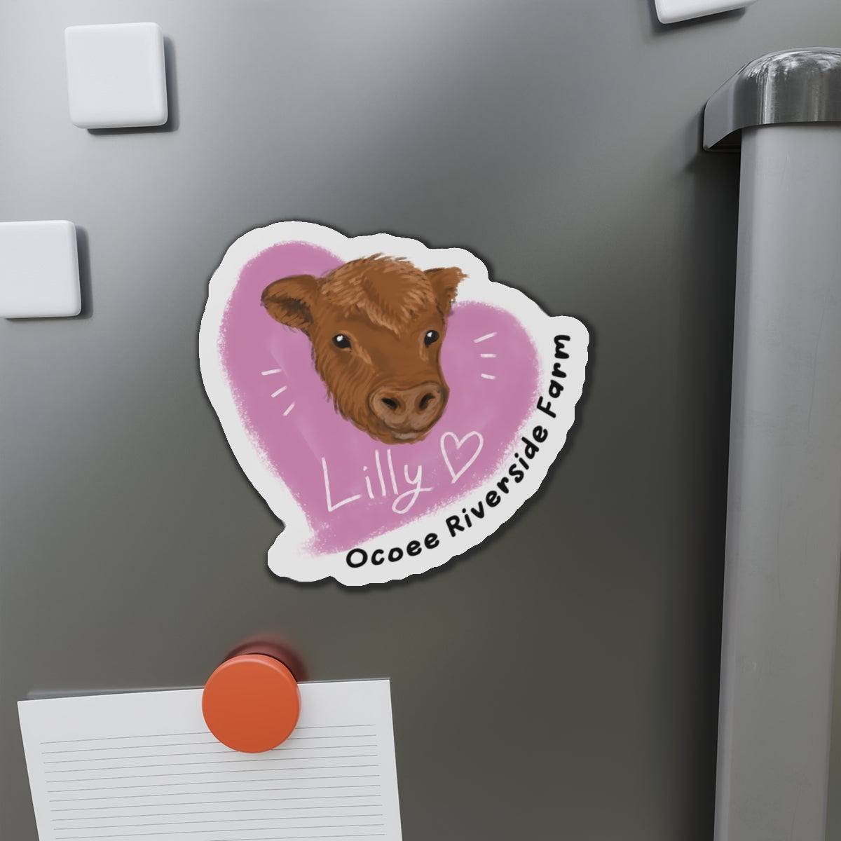 Farm animal die-cut magnet featuring a cute cow head with Lilly and Ocoee Riverside Farm text on a refrigerator door