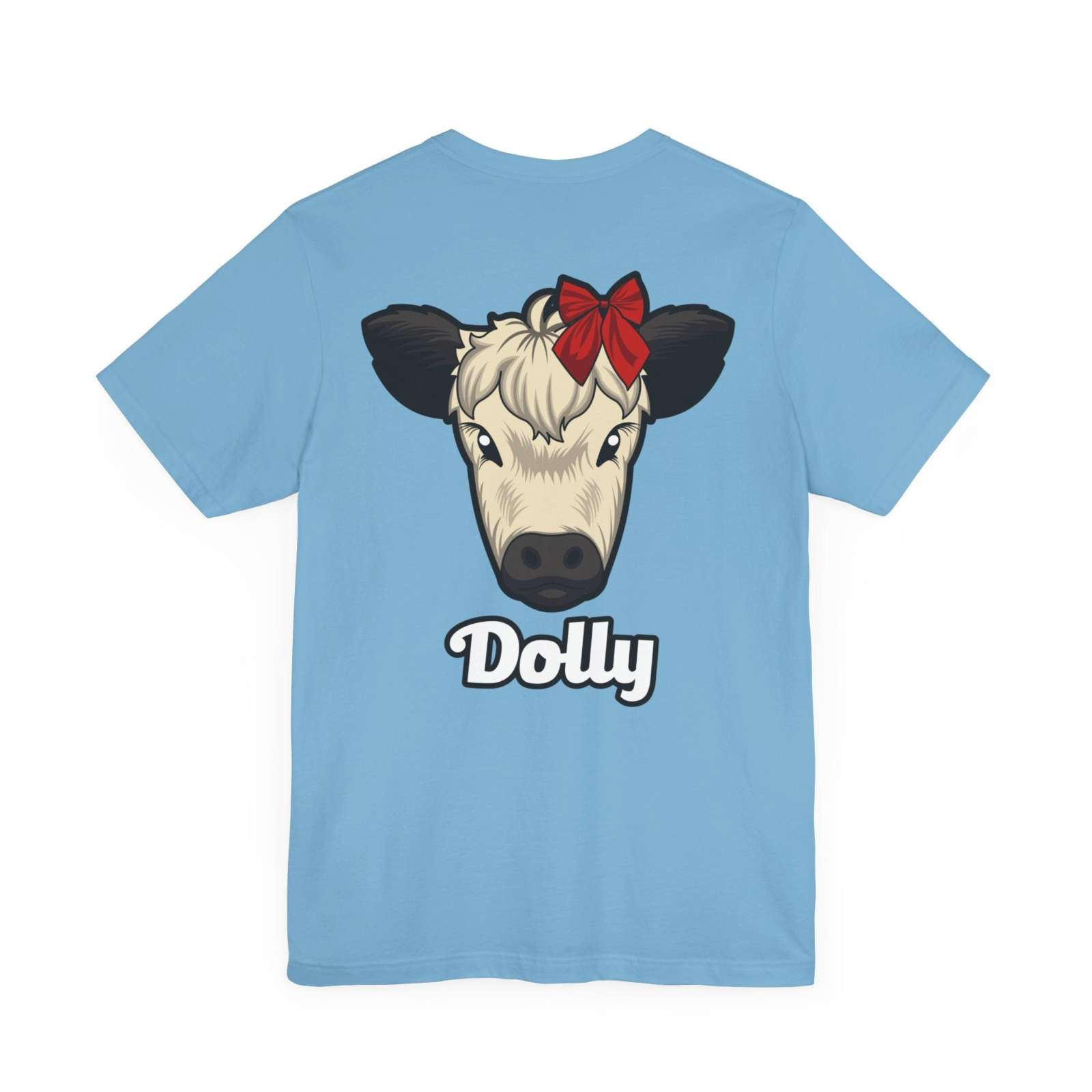 Light blue Country Cow Graphic Tee featuring a cow face named Dolly with a red bow and white text.