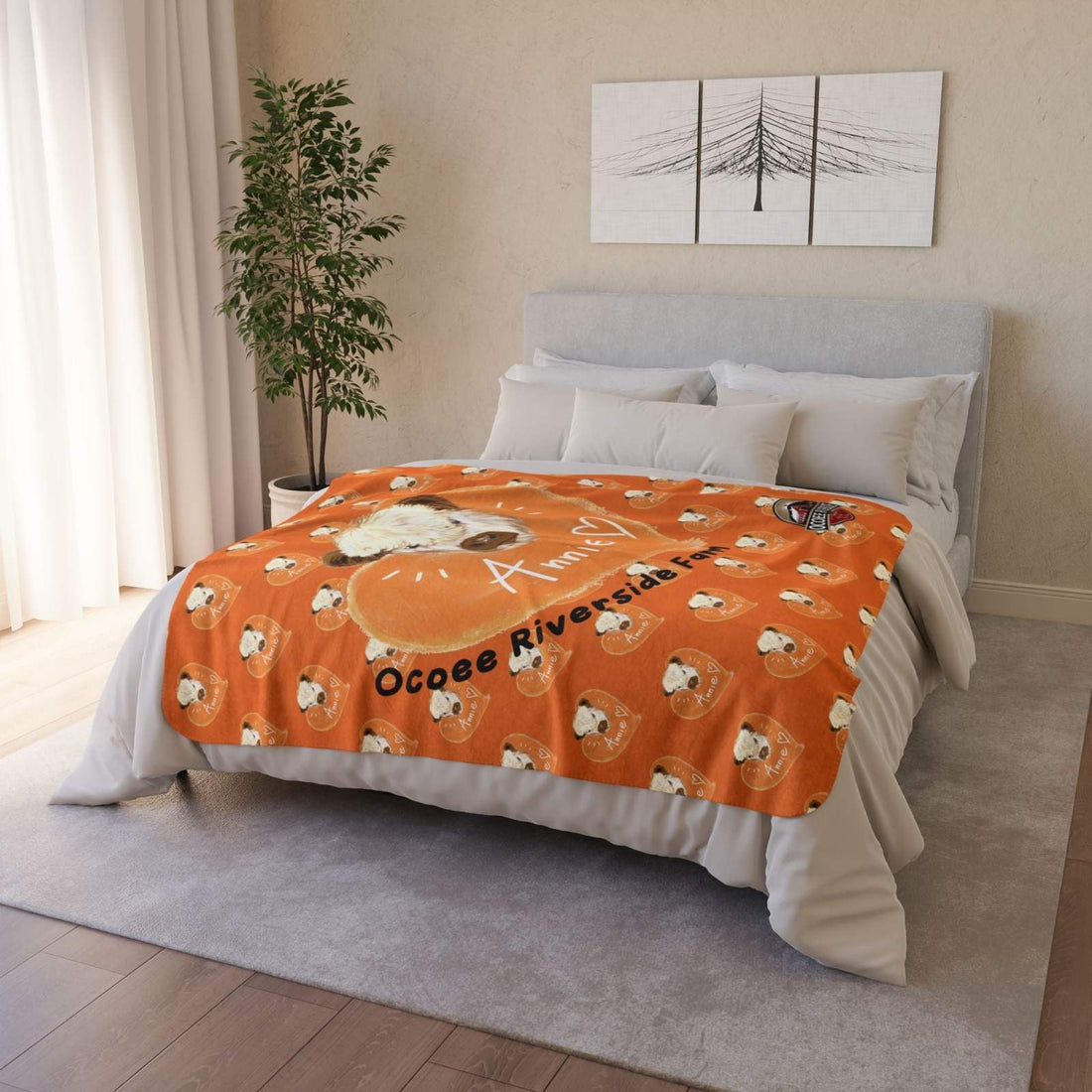 Cow-themed Sherpa blanket with orange background and cow illustrations draped over bed in modern bedroom