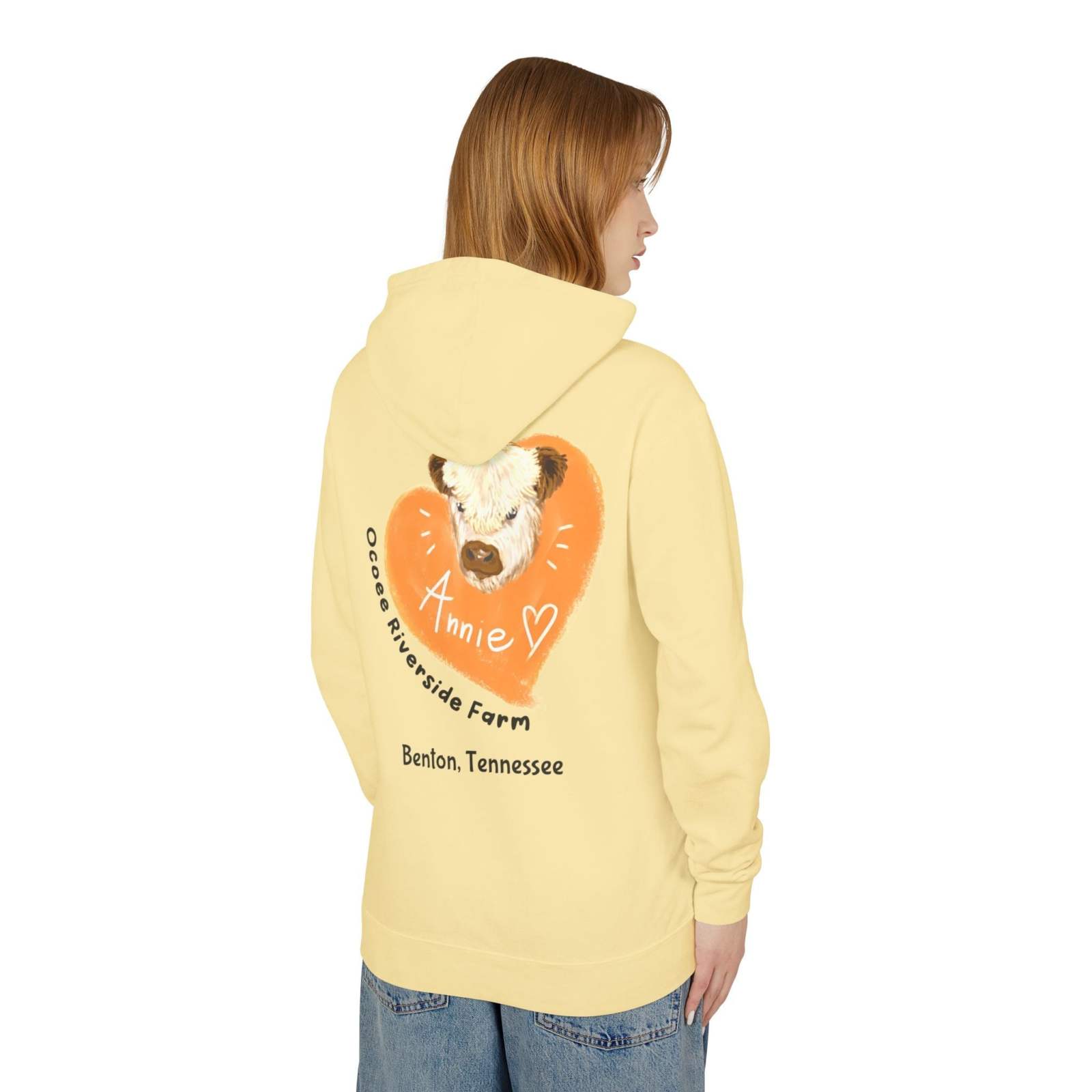 Unisex hooded sweatshirt with adorable cow design from Ocoee Riverside Farm in pale yellow, featuring soft cotton fabric and relaxed fit.