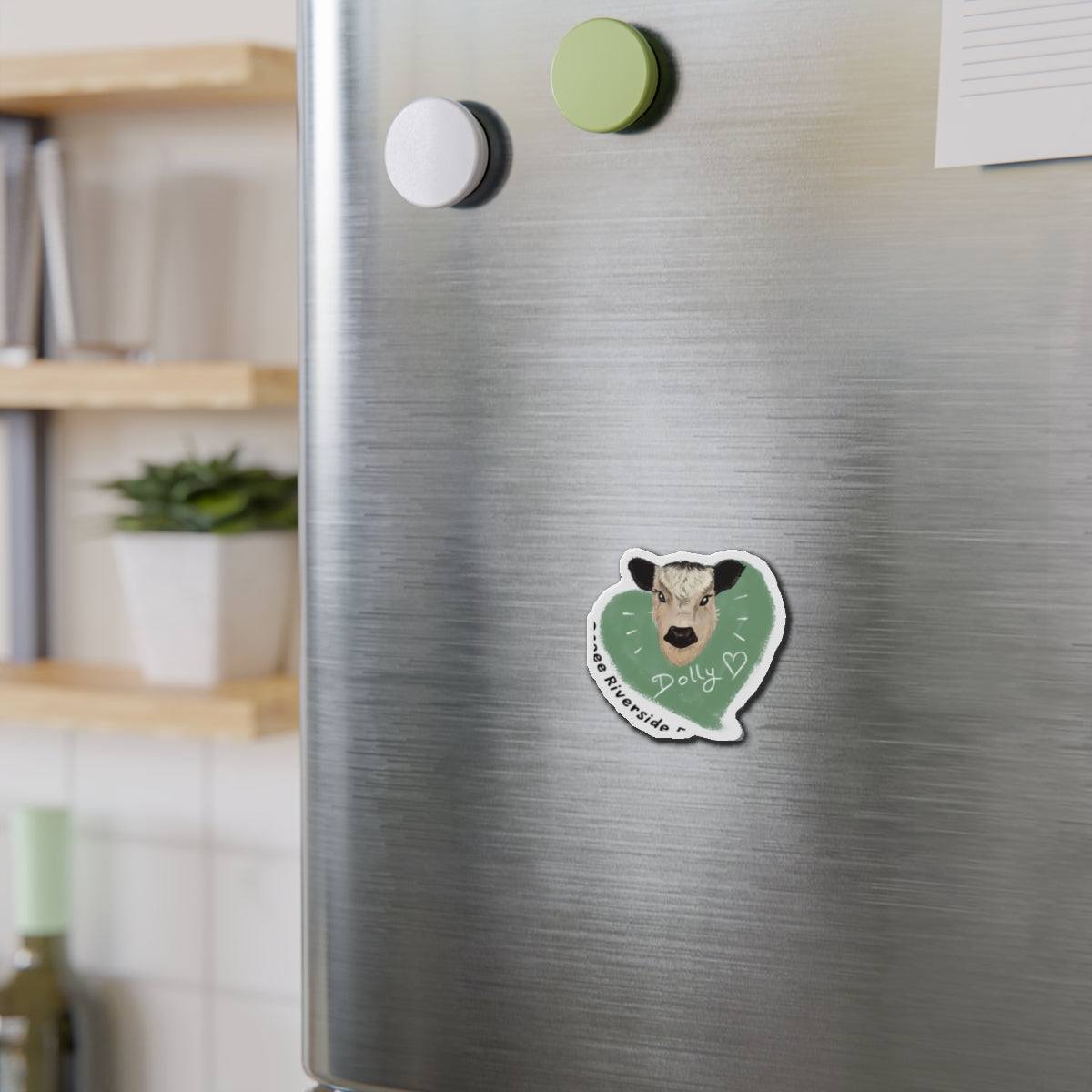 Cute cow die-cut magnet with playful farm animal design on refrigerator door
