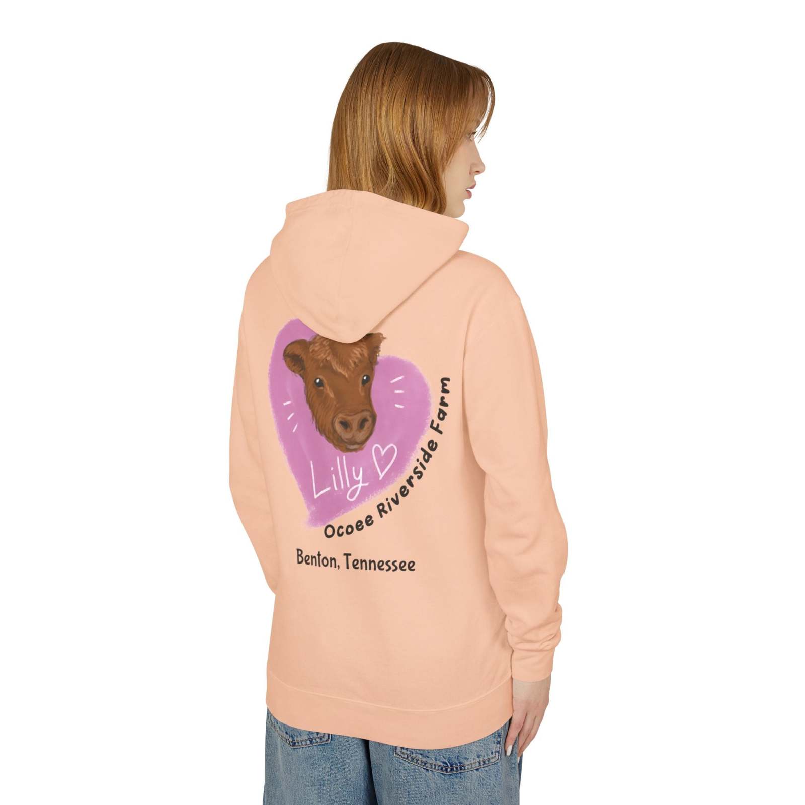 Unisex peach Cute Cow Hoodie with cow illustration and Ocoee Riverside Farm text on back